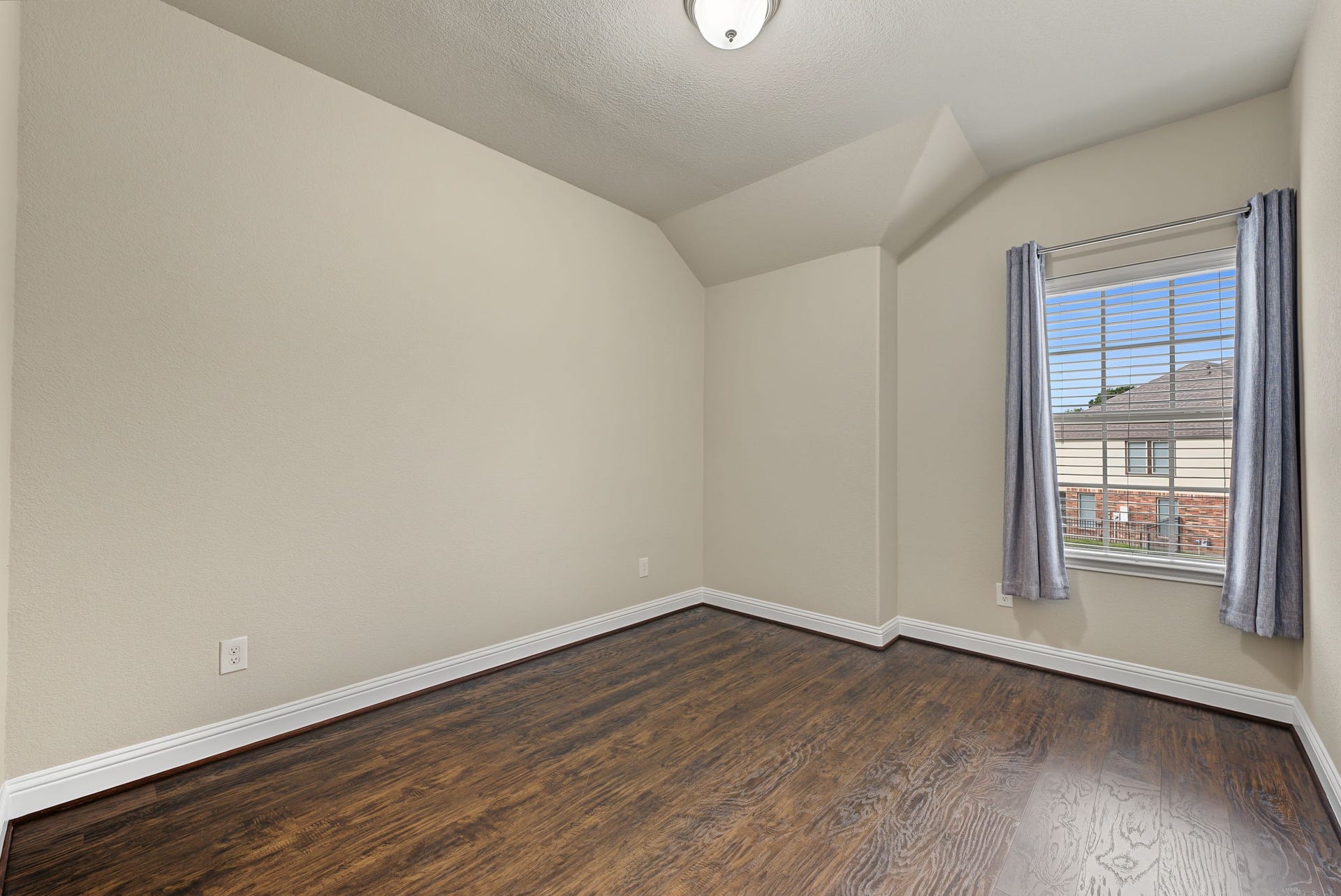 16 Centennial Ridge Place, The Woodlands, TX 77354 Bedroom 2 is a great size with a large closet.