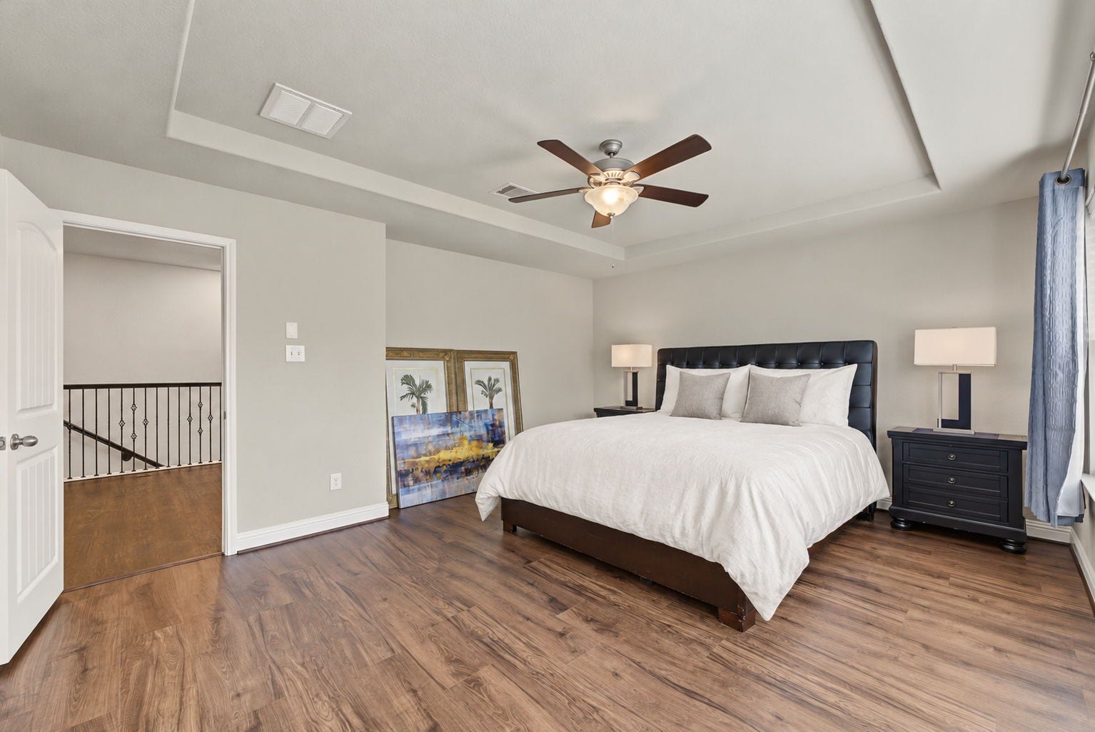 16 Centennial Ridge Place, The Woodlands, TX 77354 The primary suite is tucked away from the secondary bedrooms for added privacy.