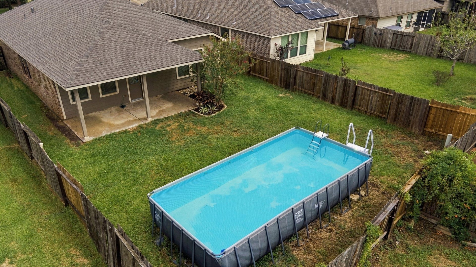 135 Piney Pathway, Magnolia, TX 77354 Sparkling above ground pool, NEW Roof and covered patio!