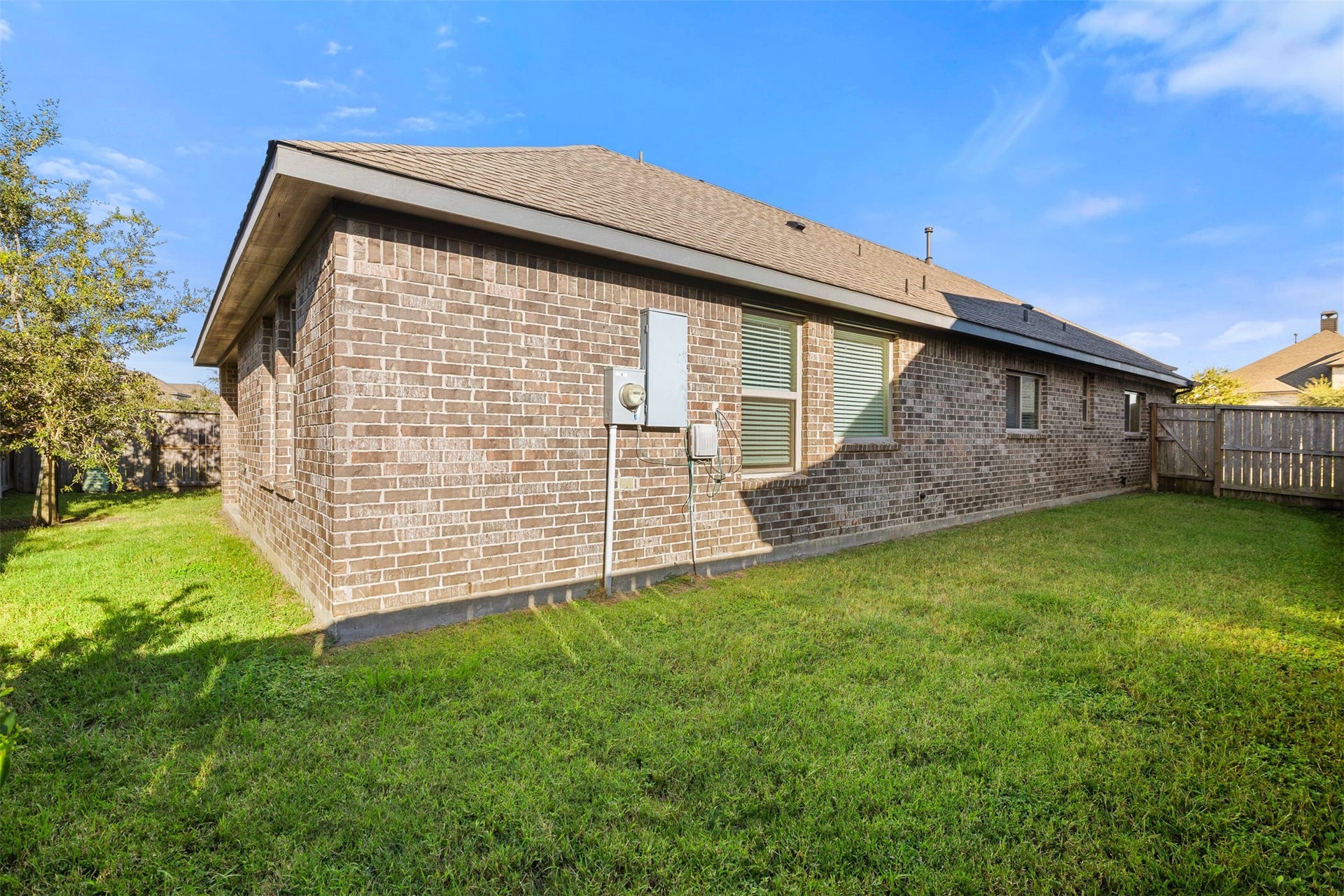 3707 Amoroso Drive, Iowa Colony, TX 77583 A fenced backyard ready for a little fresh air, a game of catch or your next outdoor project.