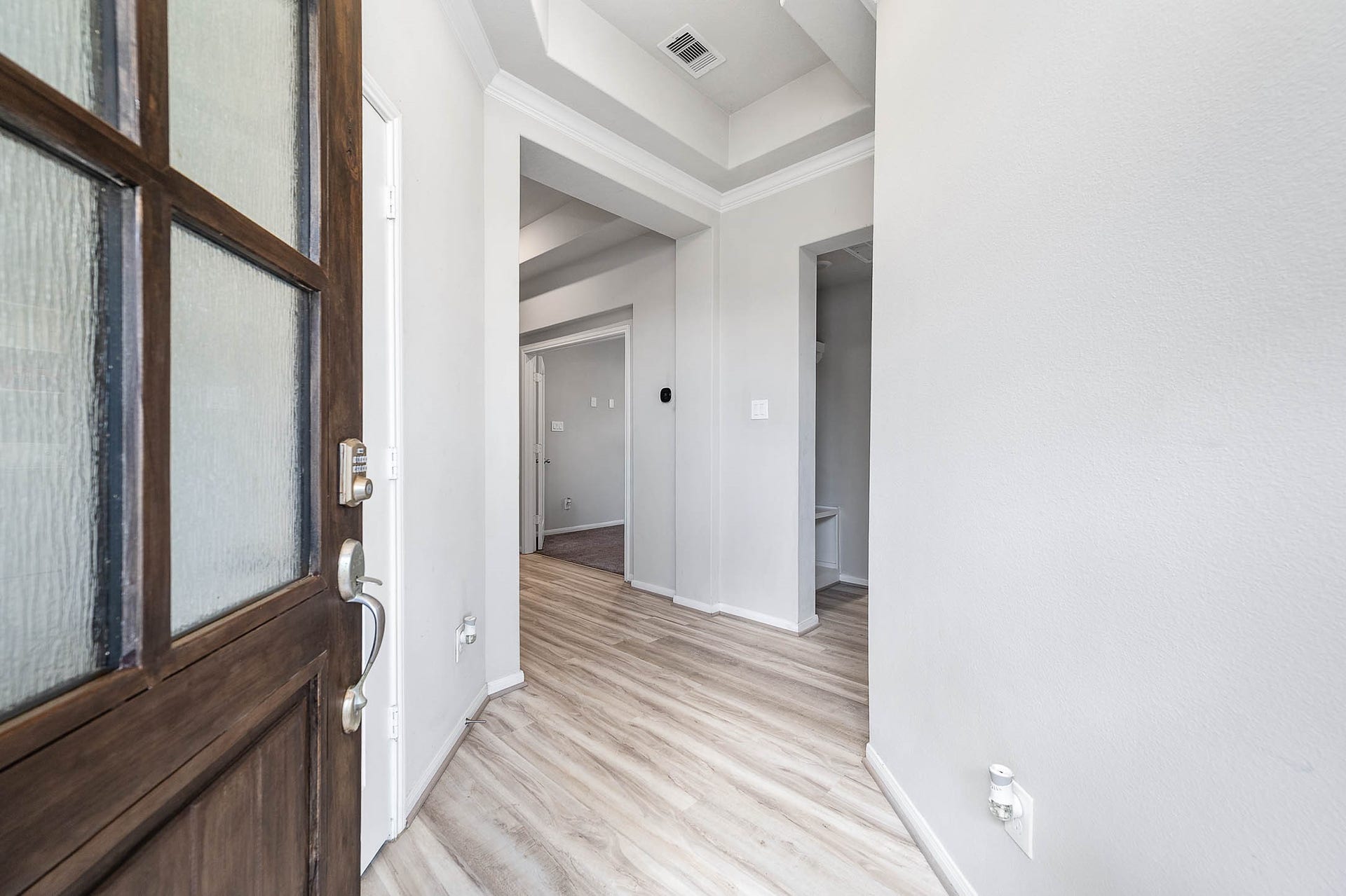 3707 Amoroso Drive, Iowa Colony, TX 77583 Walk through the 8-ft Wood Door to see raised ceilings, calm, fresh tones and wood-look Luxury Vinyl Plank flooring.