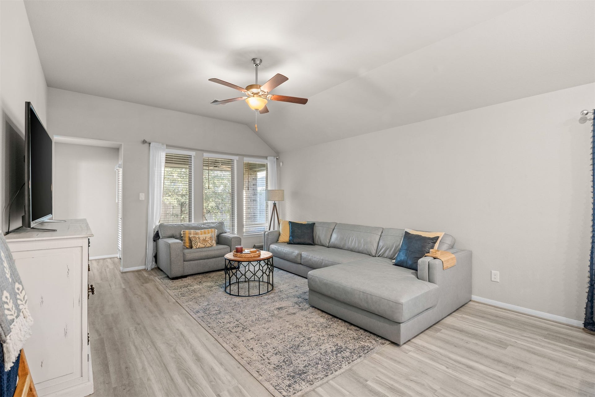 3707 Amoroso Drive, Iowa Colony, TX 77583 Snuggle in for movie night or stretch out after a long day in your inviting Living Area.
