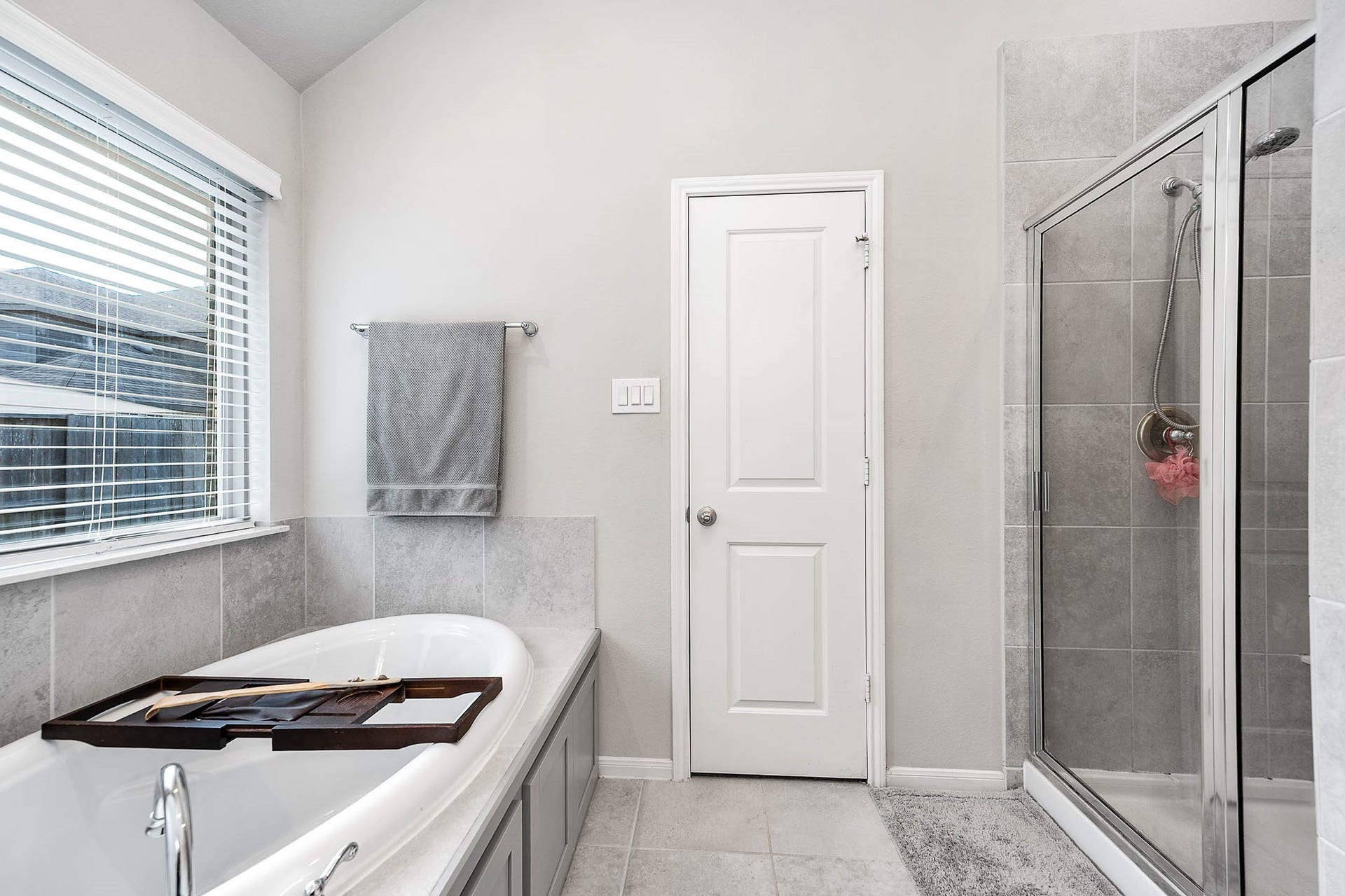 3707 Amoroso Drive, Iowa Colony, TX 77583 A quick shower or a long soak? A separate glass-enclosed shower and tub let you choose.