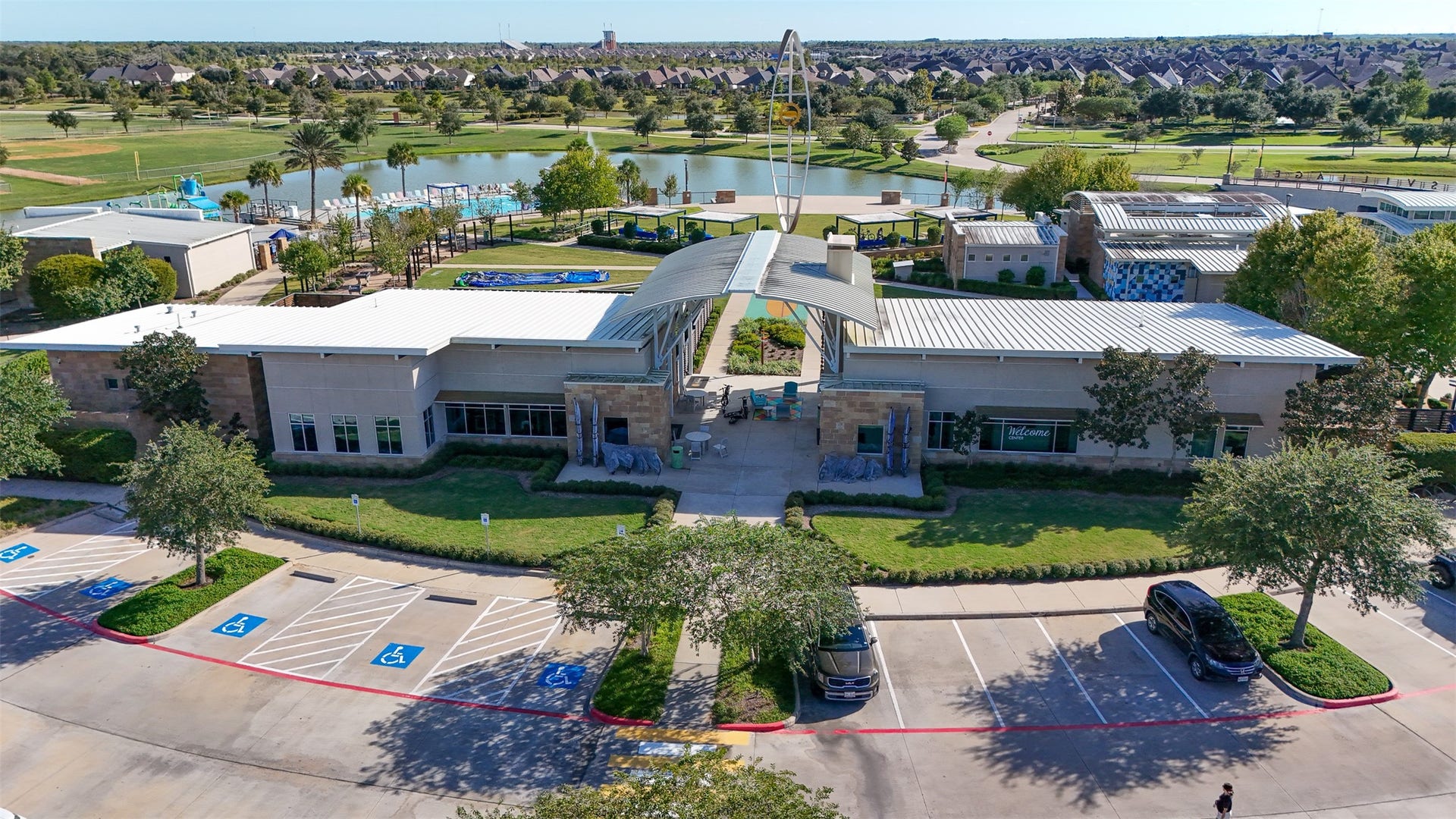 3707 Amoroso Drive, Iowa Colony, TX 77583 A bird's-eye look at Adventure Cove, with water, recreation, and gathering spaces all around.
