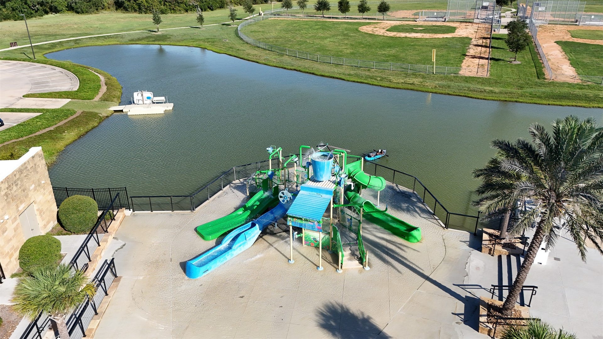 3707 Amoroso Drive, Iowa Colony, TX 77583 Slides and splash time fun, with the lake just beyond. There's more than one way to enjoy the water here!