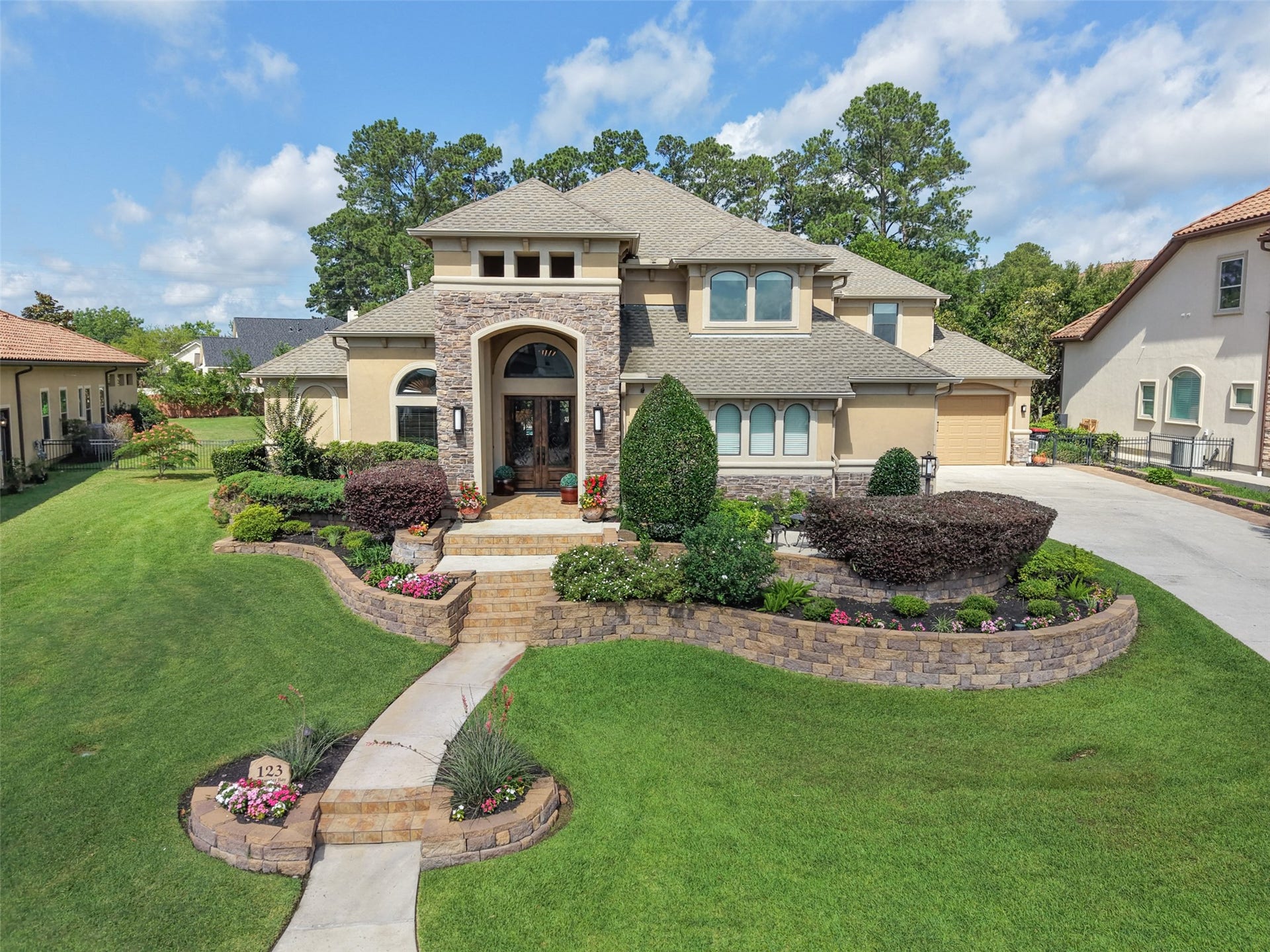 This stunning two-story home in the gated section of Bentwater withbeautifully manicured lawn and a welcoming stone pathway. The exterior boasts elegant stone accents and large windows, offering plenty of natural light. Nestled in a charming neighborhood, it's perfect for families seeking both style and comfort.