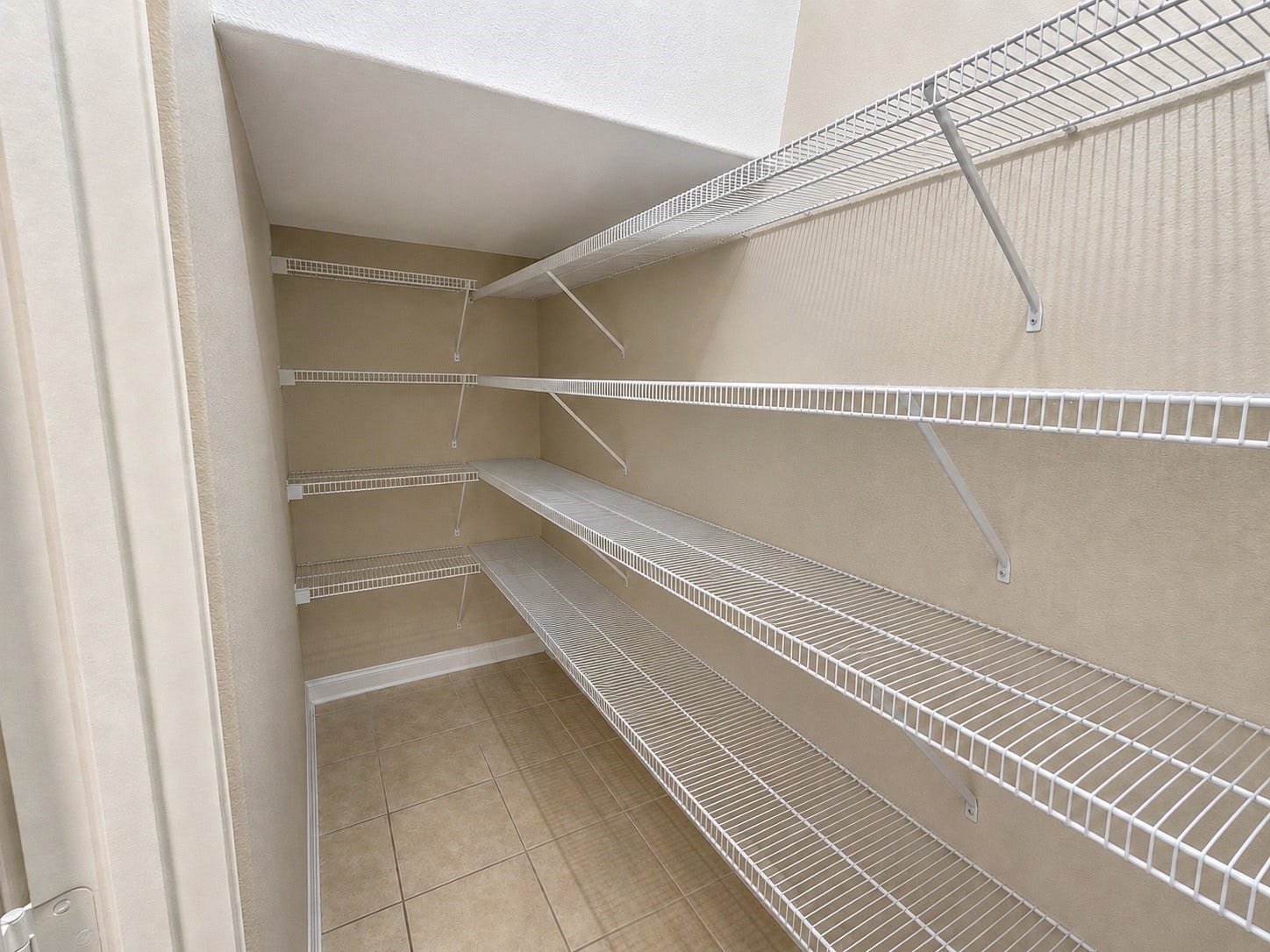 419 Turquoise Trade Drive, La Marque, TX 77568 A view of the cleared pantry, which more clearly displays the large amount of storage space it provides.