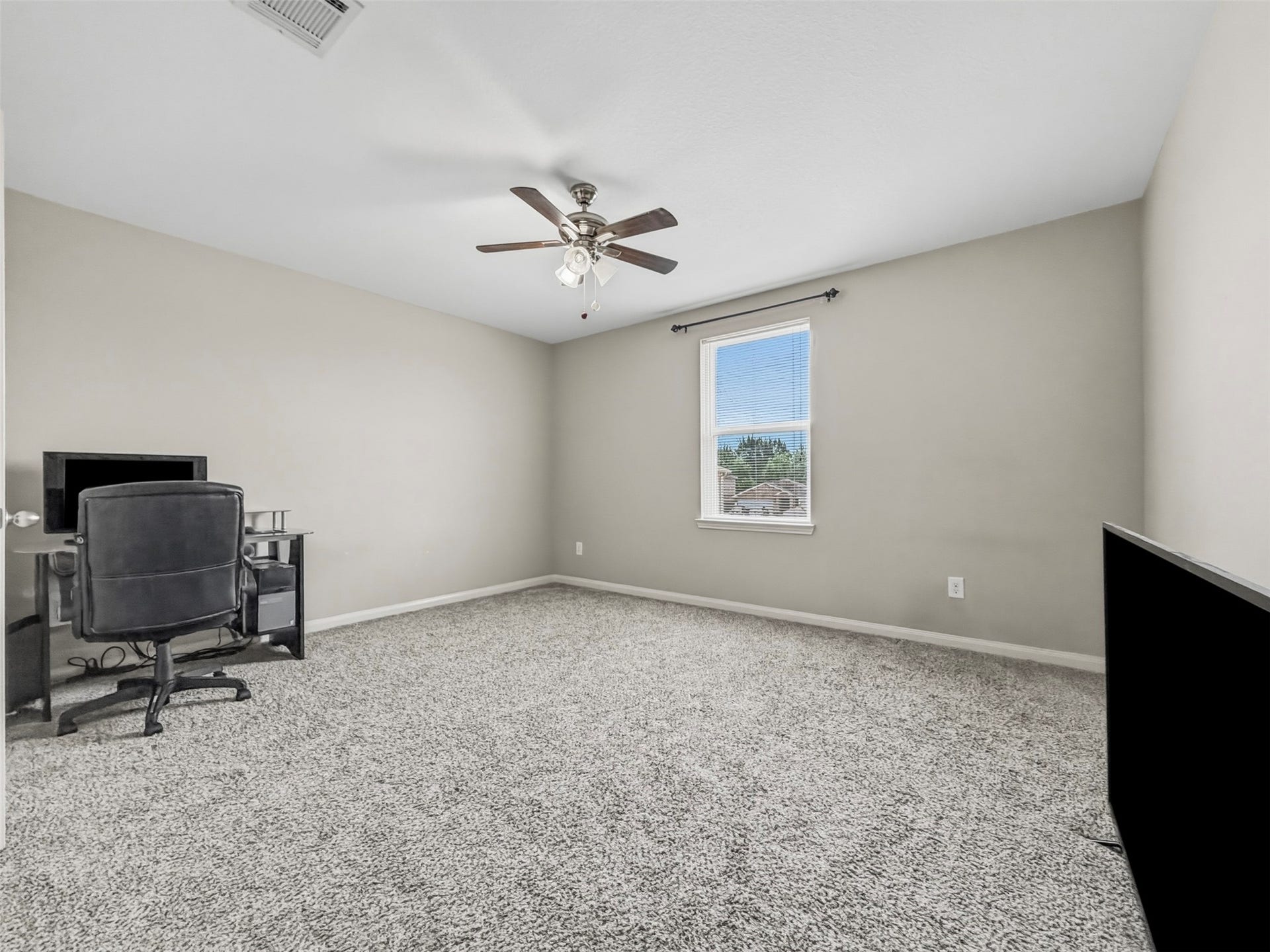 419 Turquoise Trade Drive, La Marque, TX 77568 Bedroom 4 is directly through the door to the right when first exiting Bedroom 3. This bedroom is the largest of the secondary bedrooms and also features a nice-sized walk-in closet.