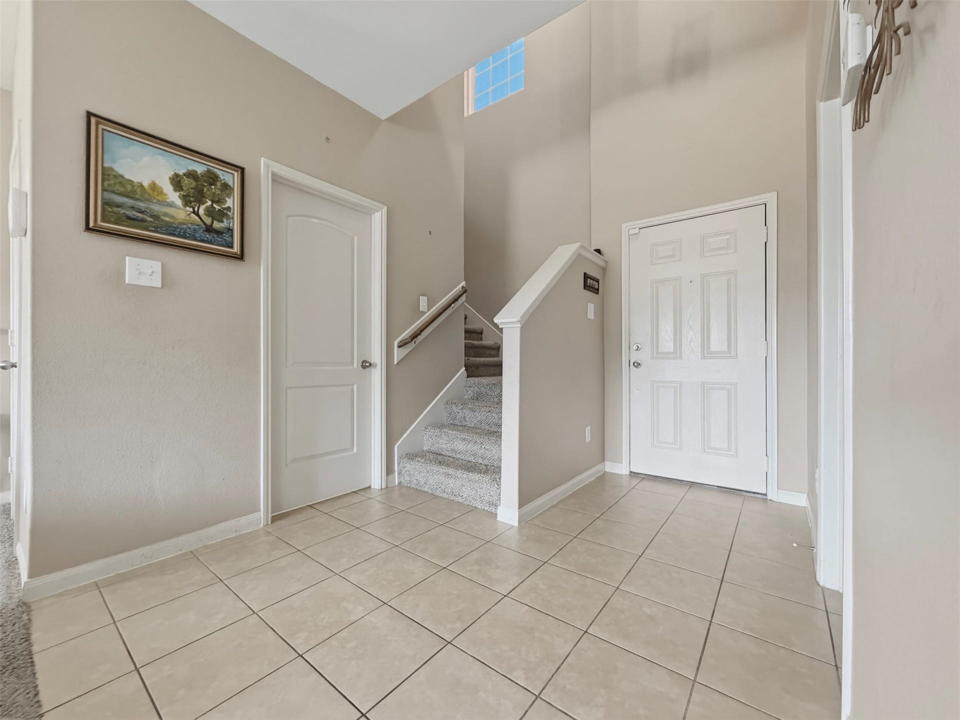 419 Turquoise Trade Drive, La Marque, TX 77568 The half bathroom is located on the first floor to the left of the staircase and right next to the Living Room. The Primary Bedroom entrance (not visible in the photo) is located directly across from the door to the half bathroom.