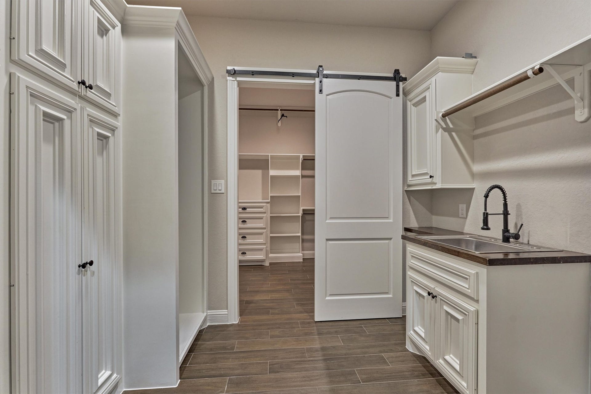 11618 Renaissance Drive, Montgomery, TX 77356 Laundry room opens to the primary closet for convenience. Laundry features cabinets for storage, sink and space for an extra refrigerator or freezer.