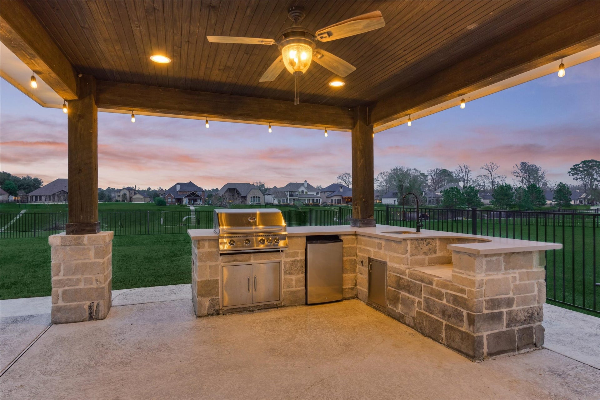 11618 Renaissance Drive, Montgomery, TX 77356 Outdoor kitchen under lighted covered patio.