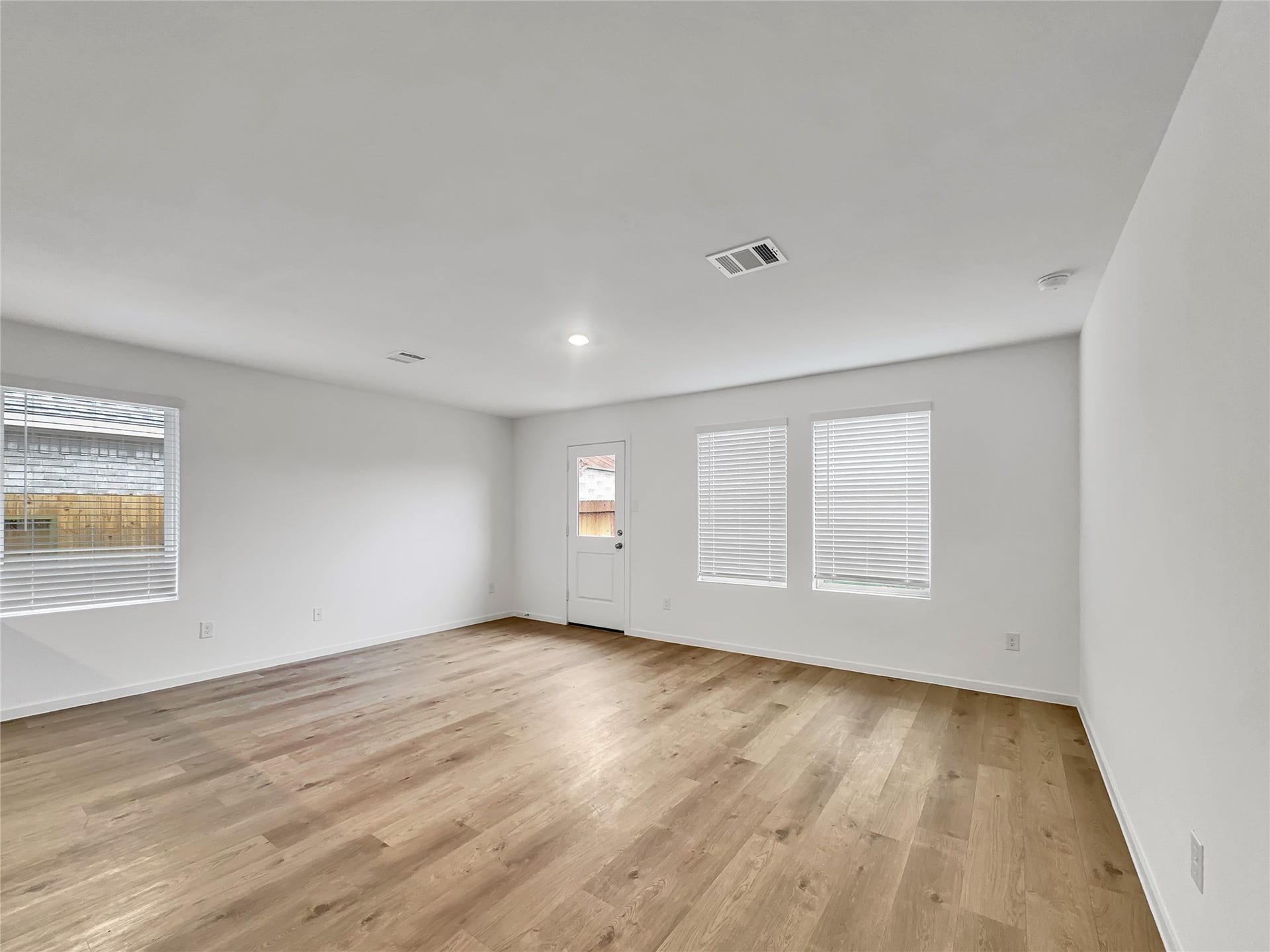 3041 Highbank Drive, Katy, TX 77493 Family room with luxury vinyl plank and natural light