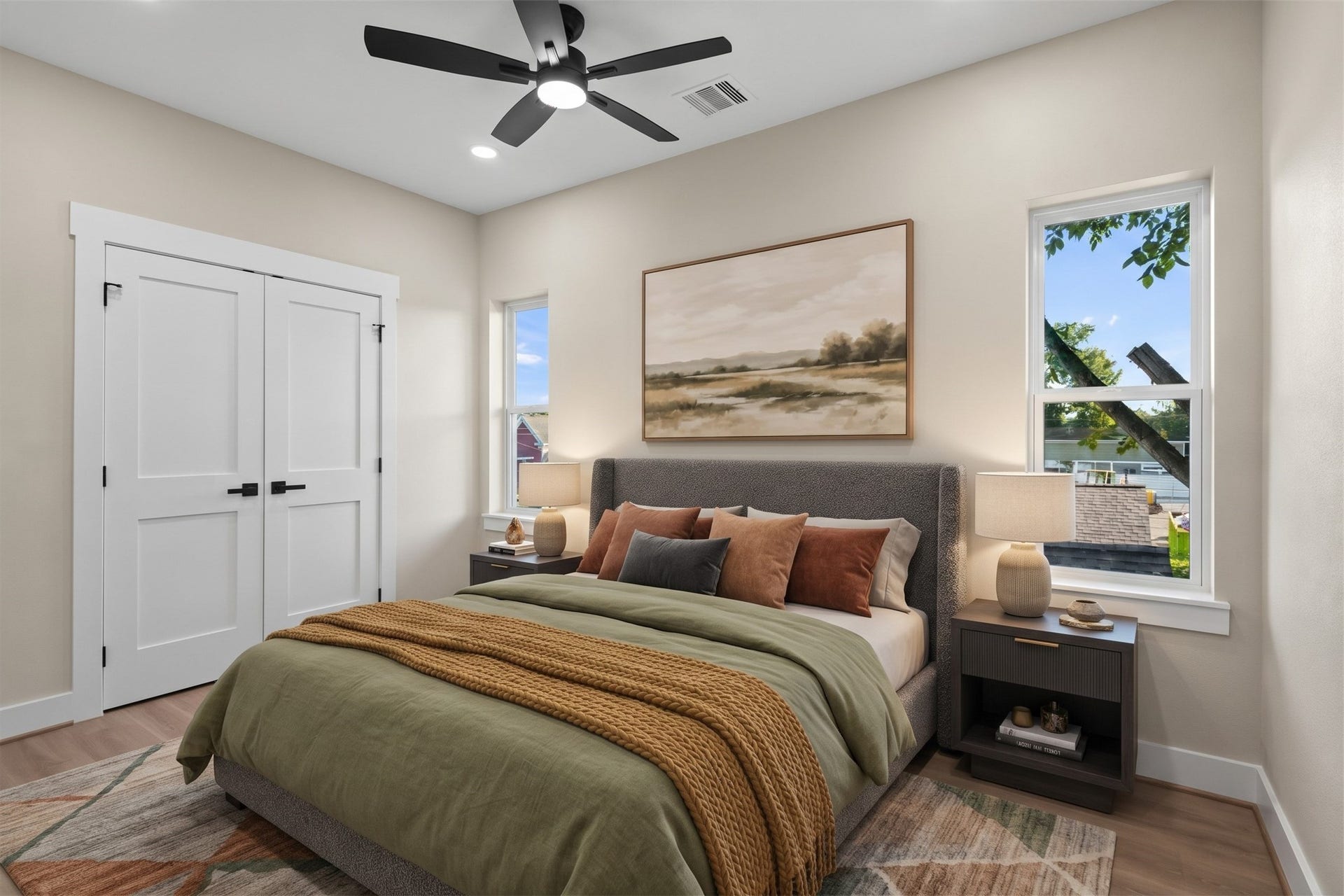 2412 Terry Street, #B, Houston, TX 77009 Virtually Staged: Blending clean design with smart utility, this bedroom offers an airy layout illuminated by multiple window placements. Elevated light fixtures and generous floor clearance make this room a practical, restful addition to the home.