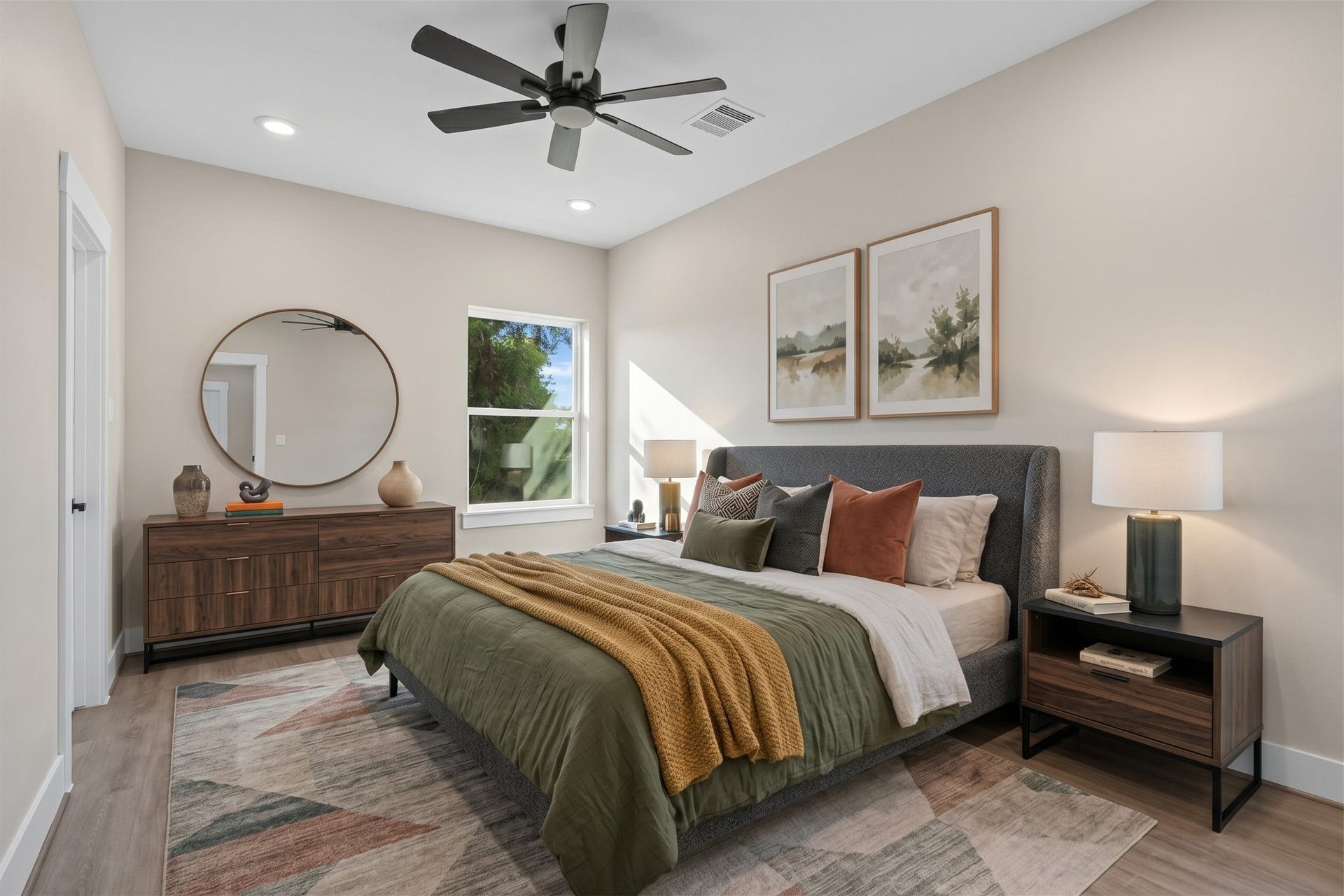 2412 Terry Street, #B, Houston, TX 77009 Virtually Staged: This cozy secondary bedroom offers a bright layout with high ceilings, recessed lighting, and a modern ceiling fan. A large side window fills the room with natural light, while the versatile floor plan easily accommodates full bedroom furniture