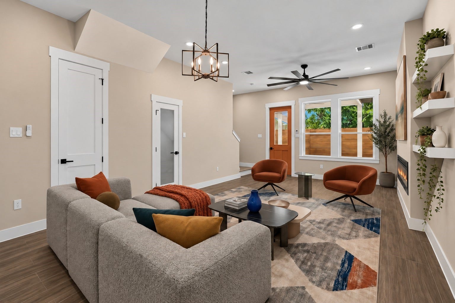 2412 Terry Street, #B, Houston, TX 77009 Virtually Staged: Large windows bring in abundant natural daylight, while floating wall shelves and an integrated fireplace elevate the overall aesthetic.