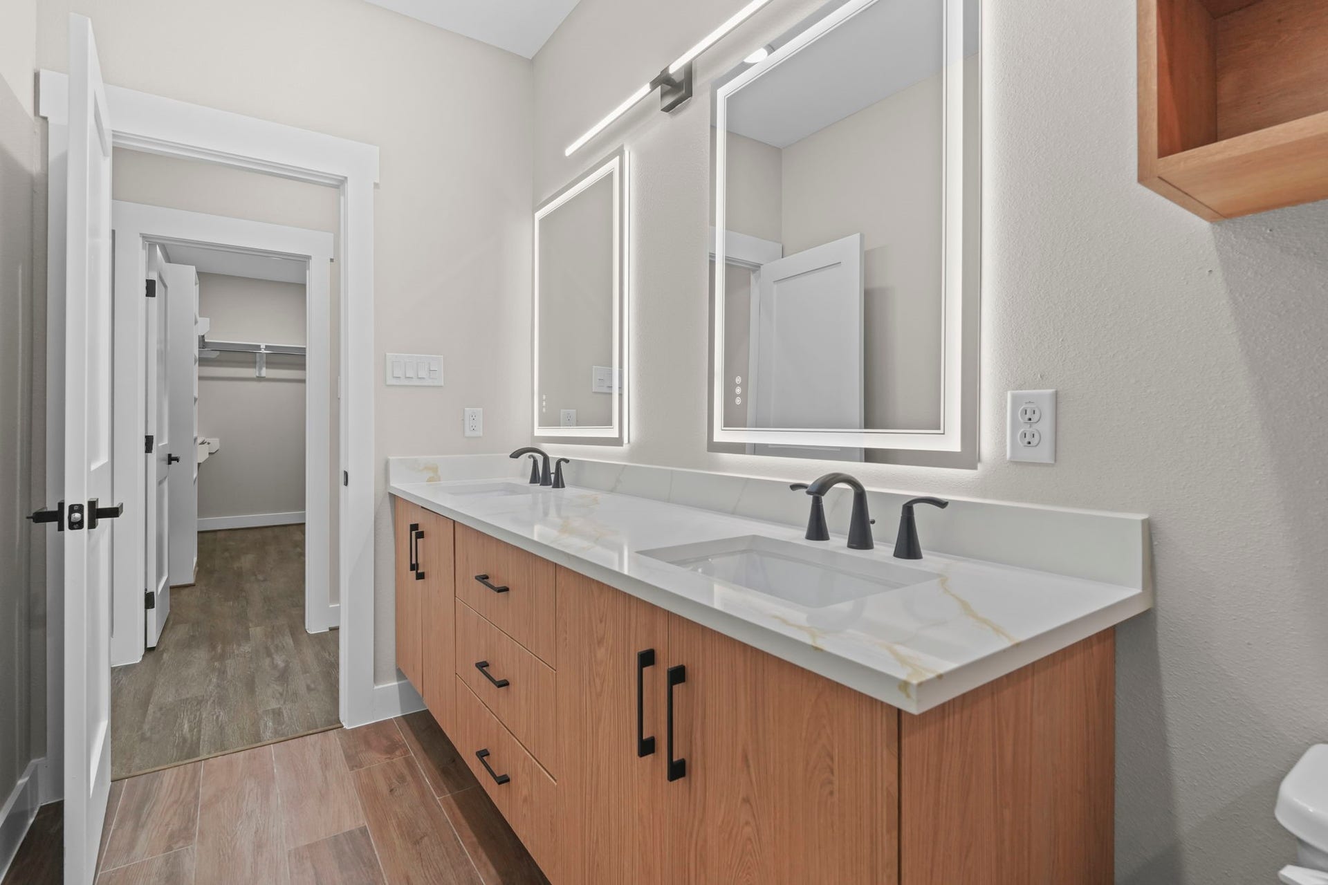 2412 Terry Street, #B, Houston, TX 77009 The functional floor plan offers excellent room clearance, seamlessly connecting the vanity zone directly to an adjoining walk-in closet.