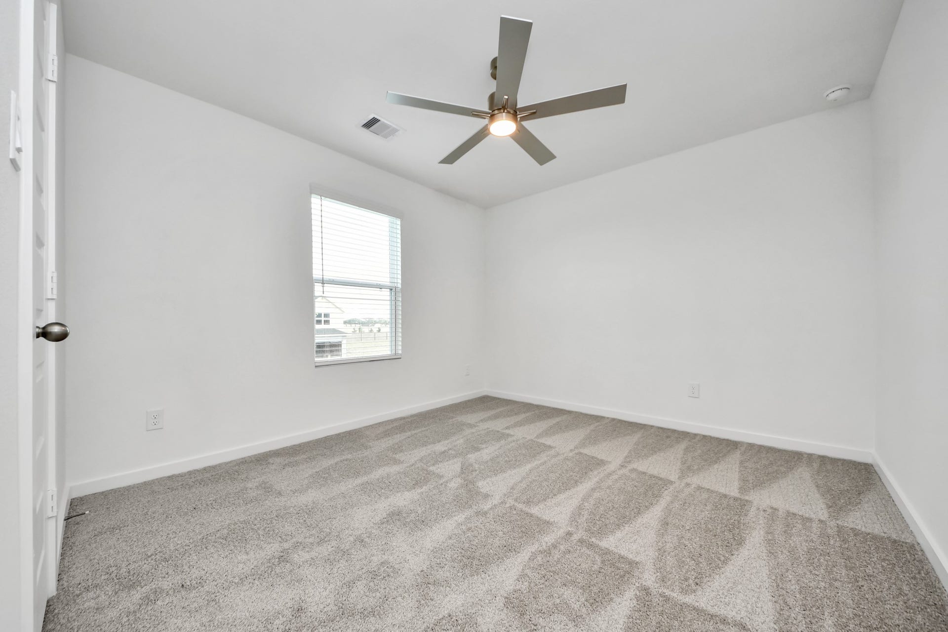 16006 Sycamore Maple Lane, Cypress, TX 77429 Secondary bedroom features plush carpeting, large windows that let in plenty of natural light, bright paint, and spacious closets. Sample photo of completed home with similar floor plan. Actual colors and selections may vary.