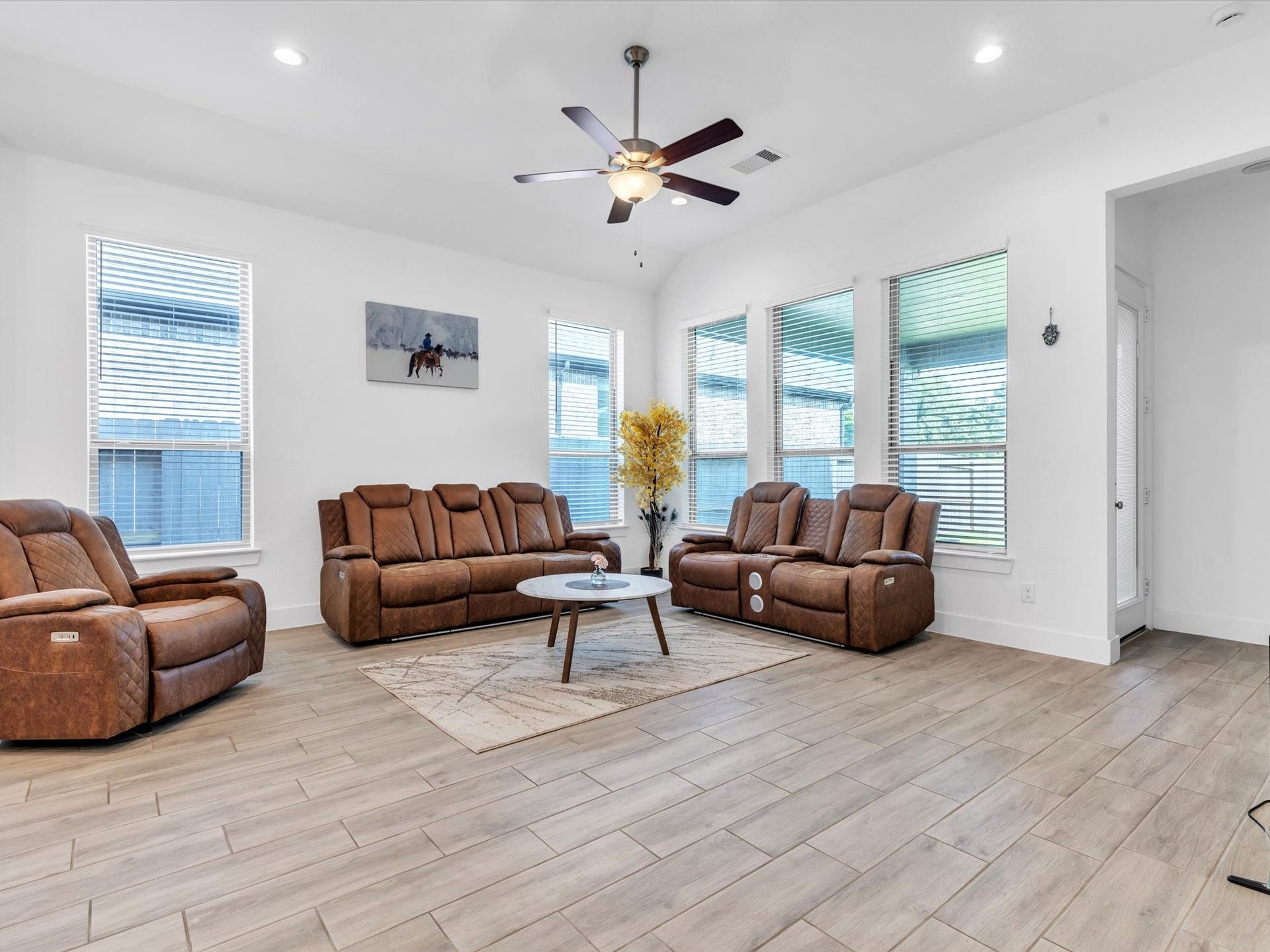 10718 Hidden Rock Drive, Missouri City, TX 77459 The spacious living room is filled with natural light and offers an open, comfortable gathering space that connects effortlessly with the kitchen and dining areas.
