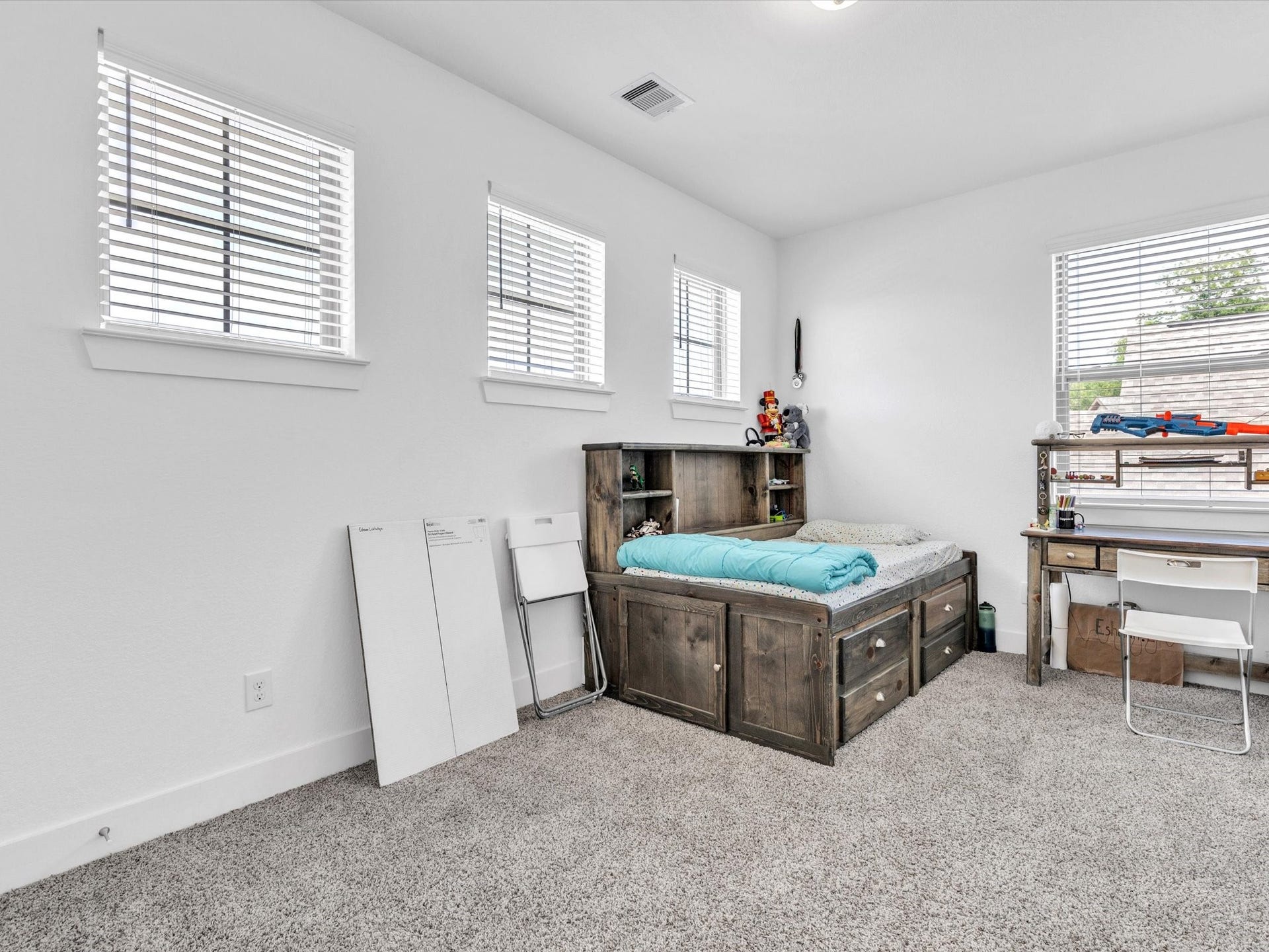 10718 Hidden Rock Drive, Missouri City, TX 77459 The fourth bedroom is bright and spacious with multiple windows providing abundant natural light and plenty of room to make the space your own.