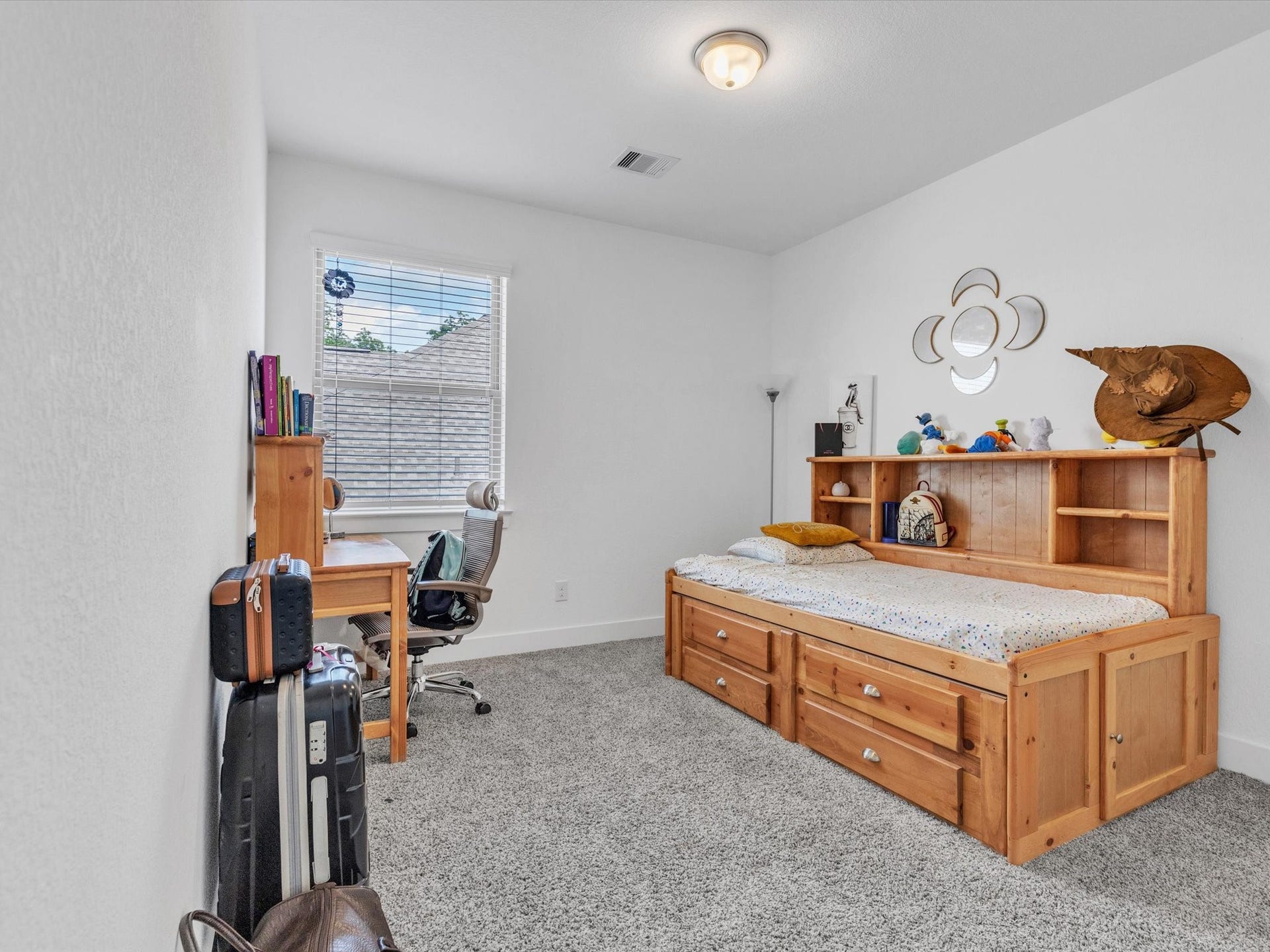 10718 Hidden Rock Drive, Missouri City, TX 77459 Bedroom three features a comfortable layout, dedicated closet and the privacy of the homes second floor.