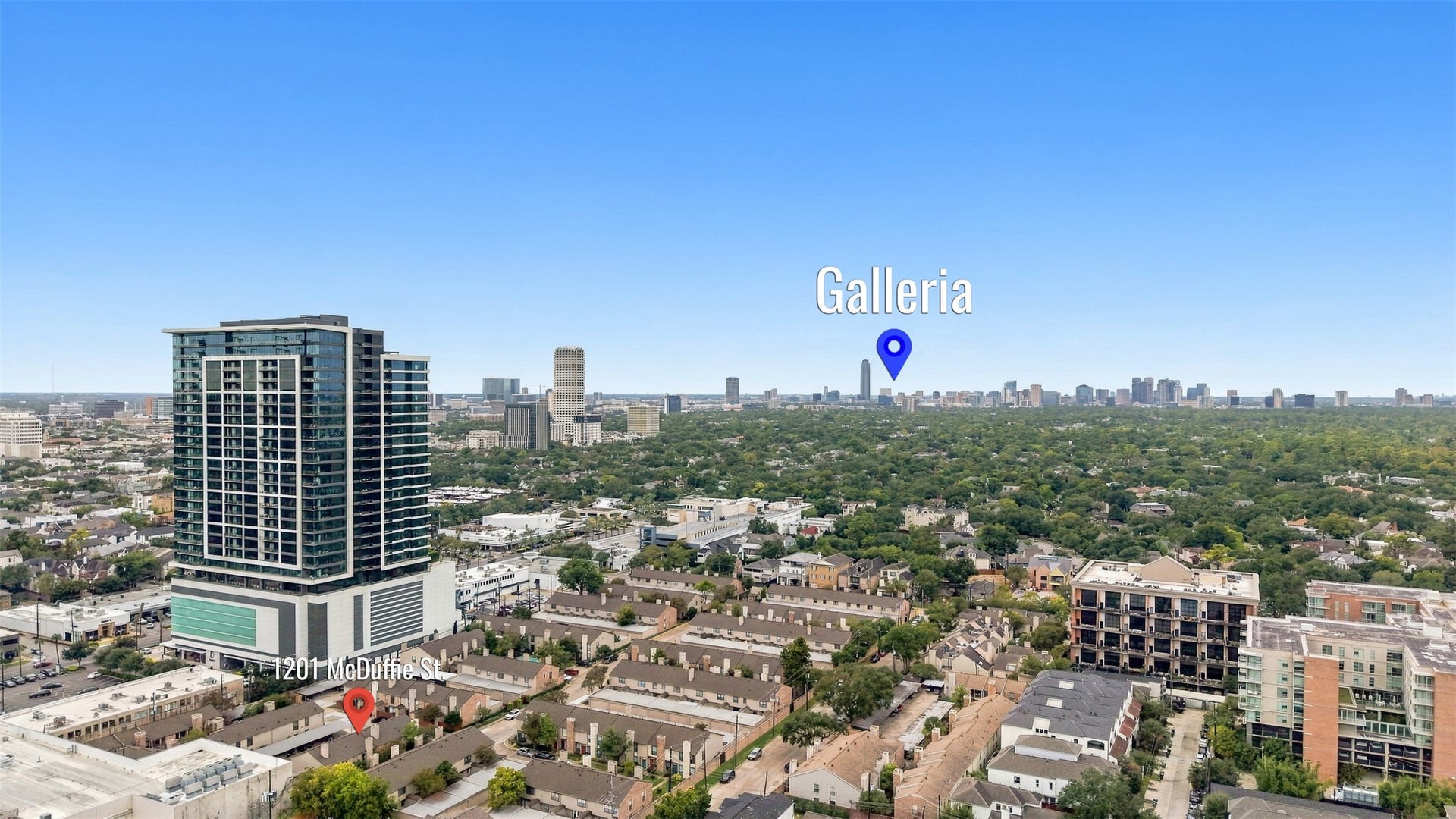 1201 Mcduffie Street, #212, Houston, TX 77019 Stunning aerial view of a vibrant urban landscape featuring a modern high-rise and proximity to the bustling Galleria area, perfect for those seeking city living with convenience.