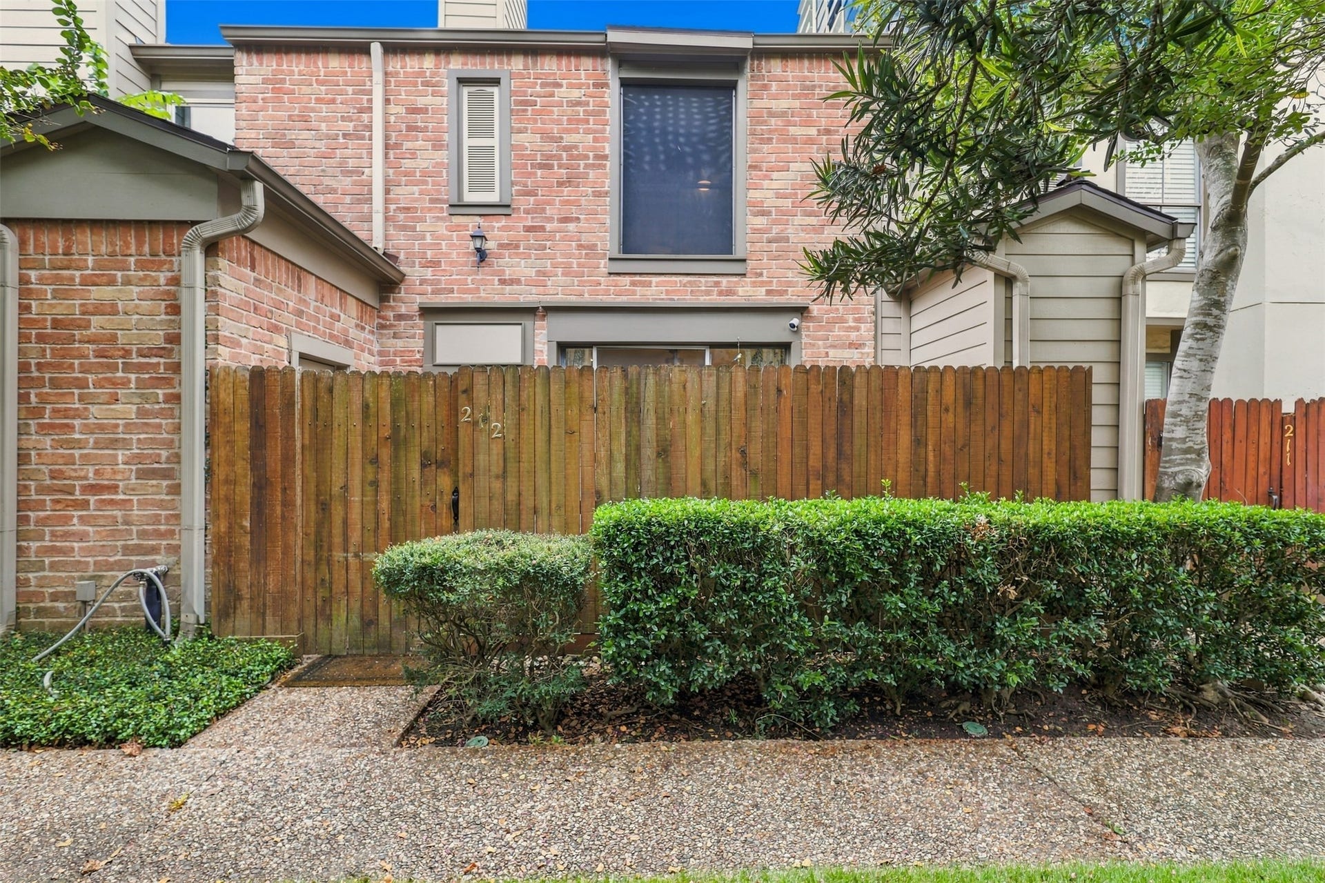 1201 Mcduffie Street, #212, Houston, TX 77019 The fenced courtyard offers a sense of privacy before you even step inside.