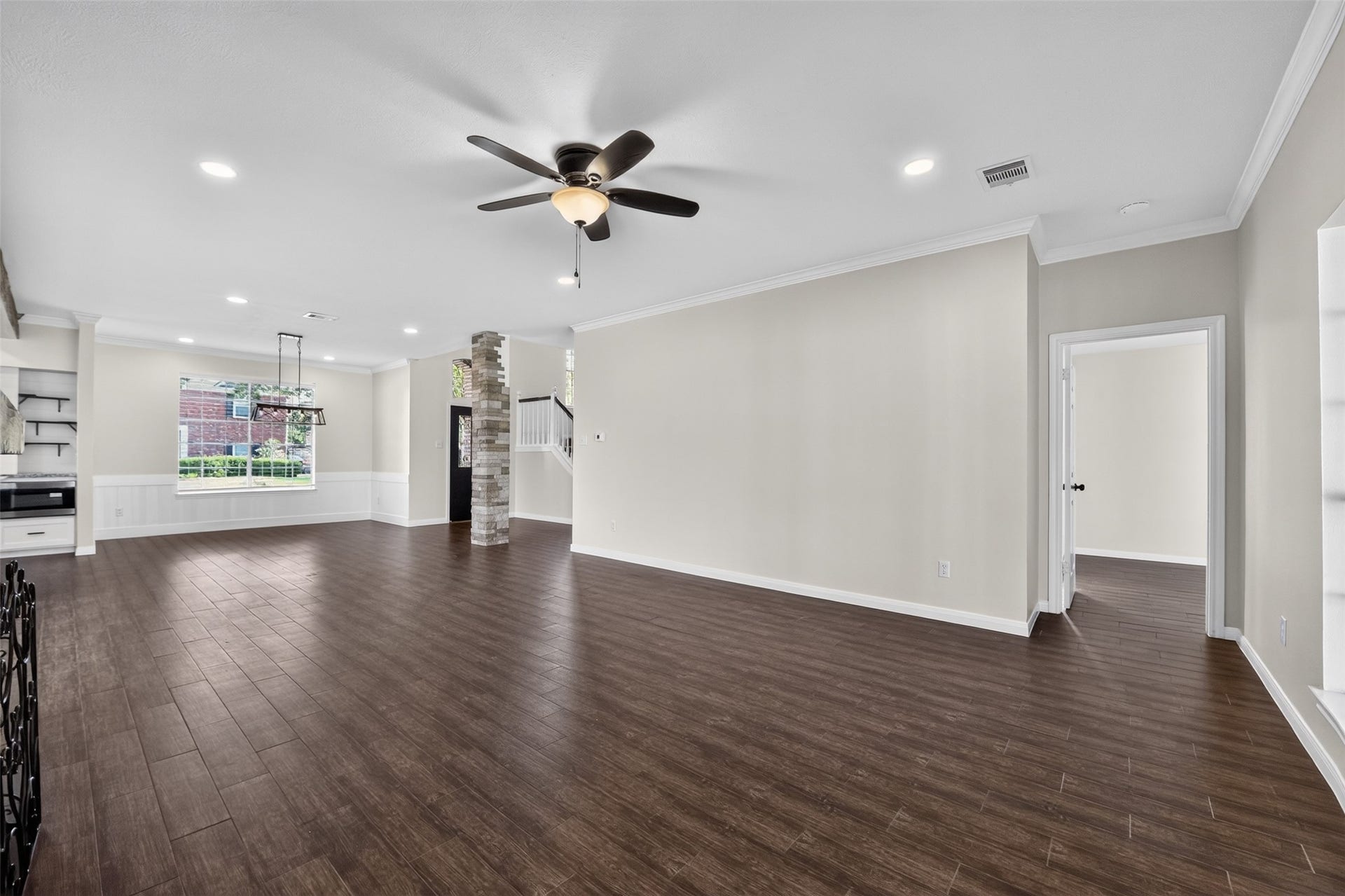 Living area leading into primary bedroom.