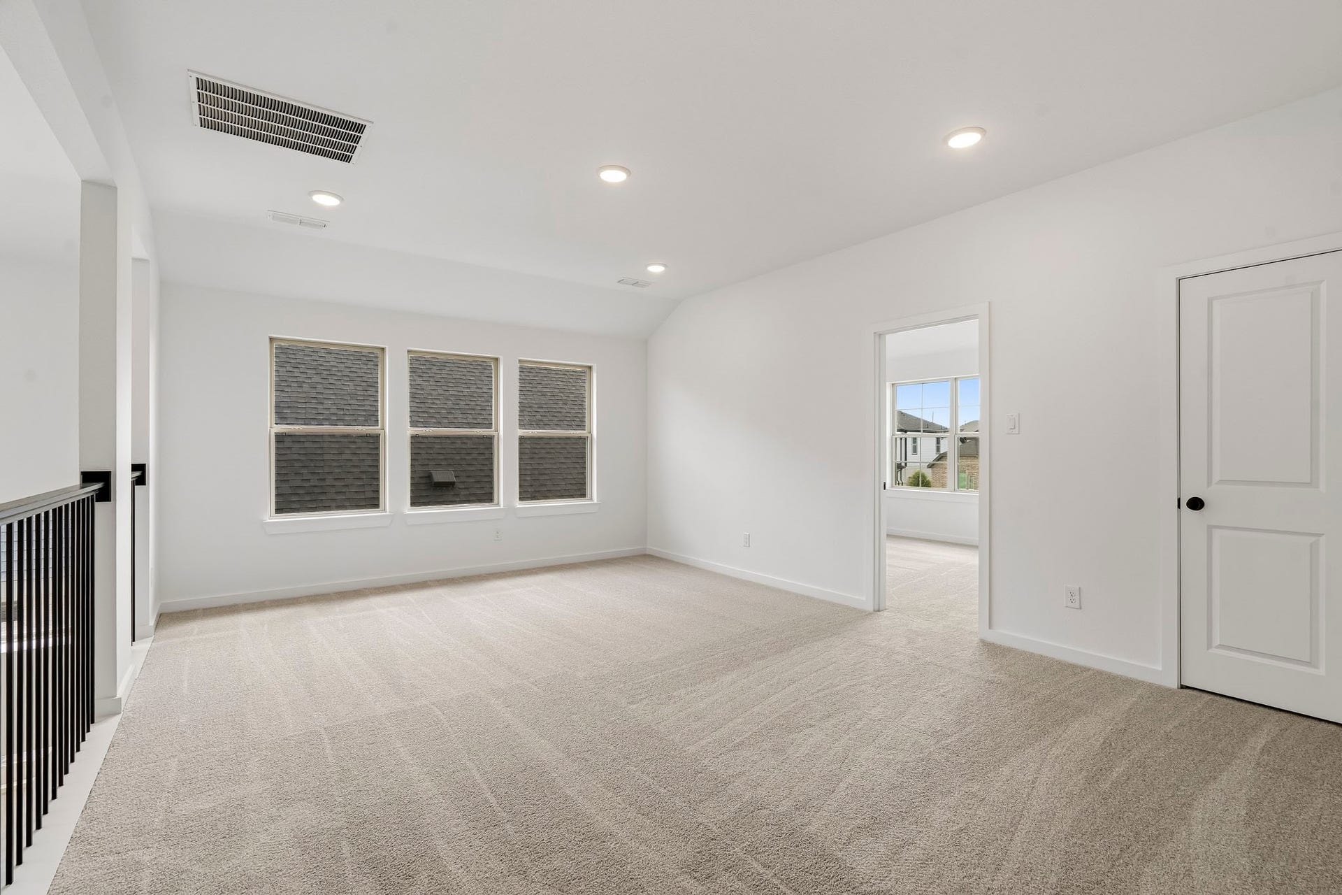 4510 Sunny Hazel Lane, Fulshear, TX 77441 Large upstairs game room with open railing overlooking the living area.