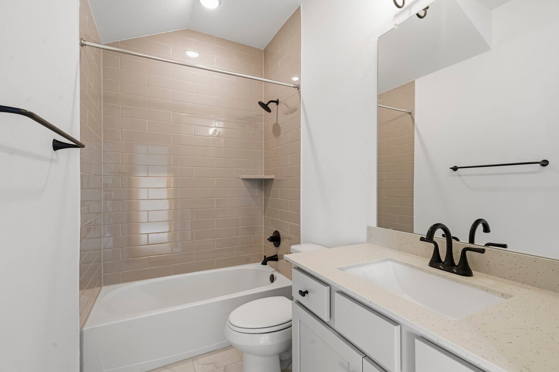 4510 Sunny Hazel Lane, Fulshear, TX 77441 Full secondary bathroom with tub/shower combination and tile surround.