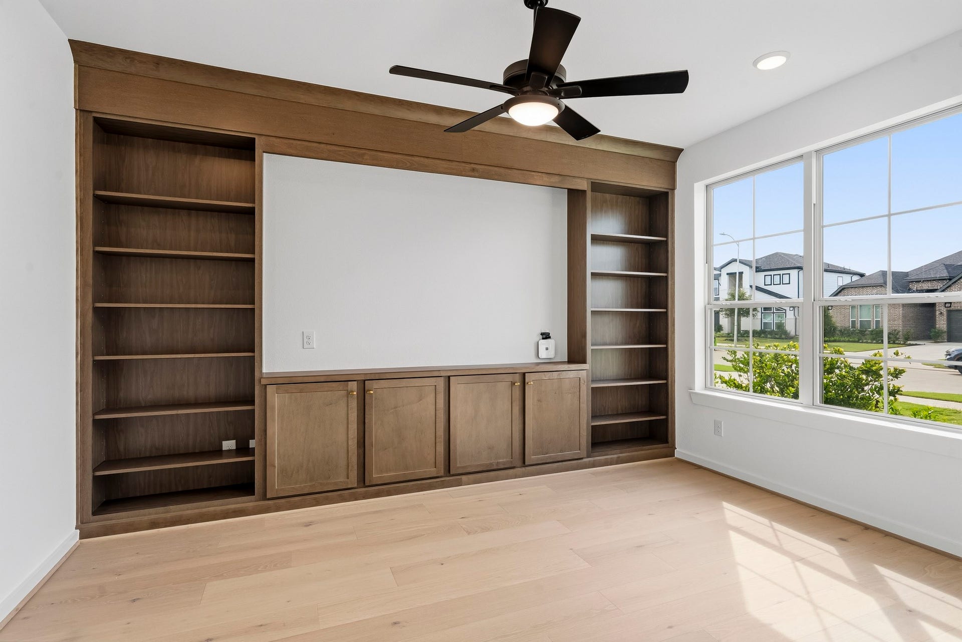 4510 Sunny Hazel Lane, Fulshear, TX 77441 Private study with custom built-in cabinetry and shelving.