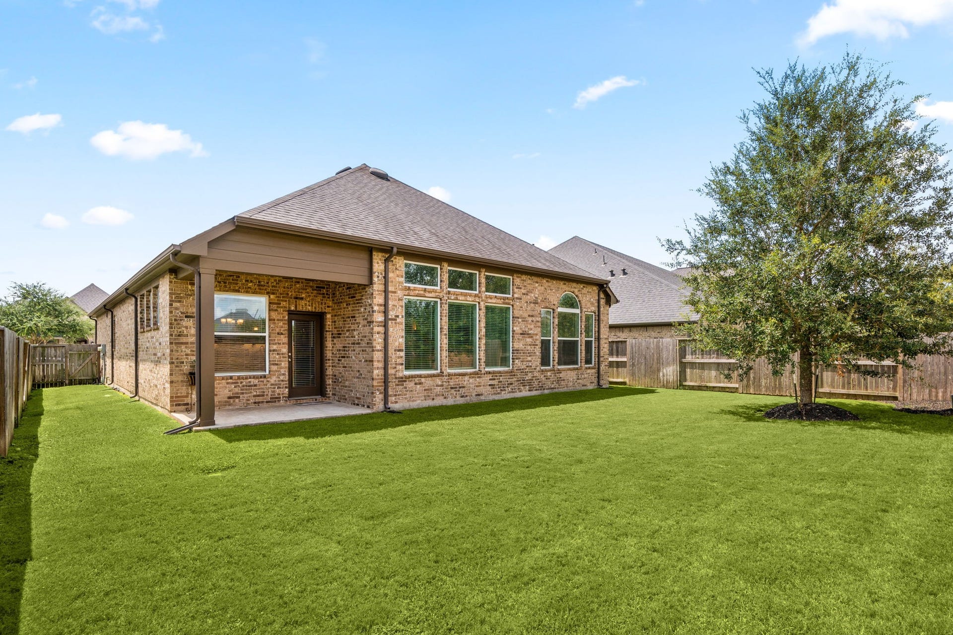 6922 Goldstrum Way, Katy, TX 77493 The spacious backyard offers a covered patio and plenty of green space, with no back neighbors for added privacy.