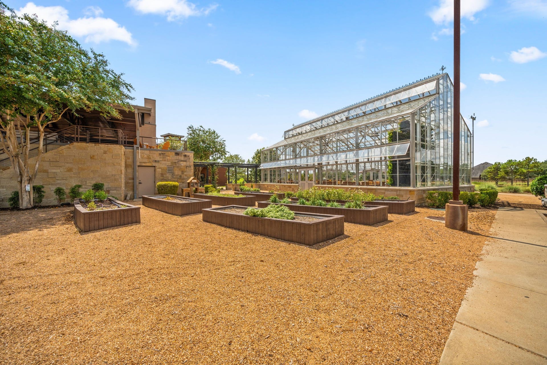 6922 Goldstrum Way, Katy, TX 77493 The Conservatory at Cane Island brings a distinctive garden-inspired gathering space to the heart of Cane Quarter, with dramatic glass walls and vertical gardens designed for resident events and celebrations. Just outside, raised community garden beds add another unique touch to the amenity-rich Cane Island lifestyle in Katy.