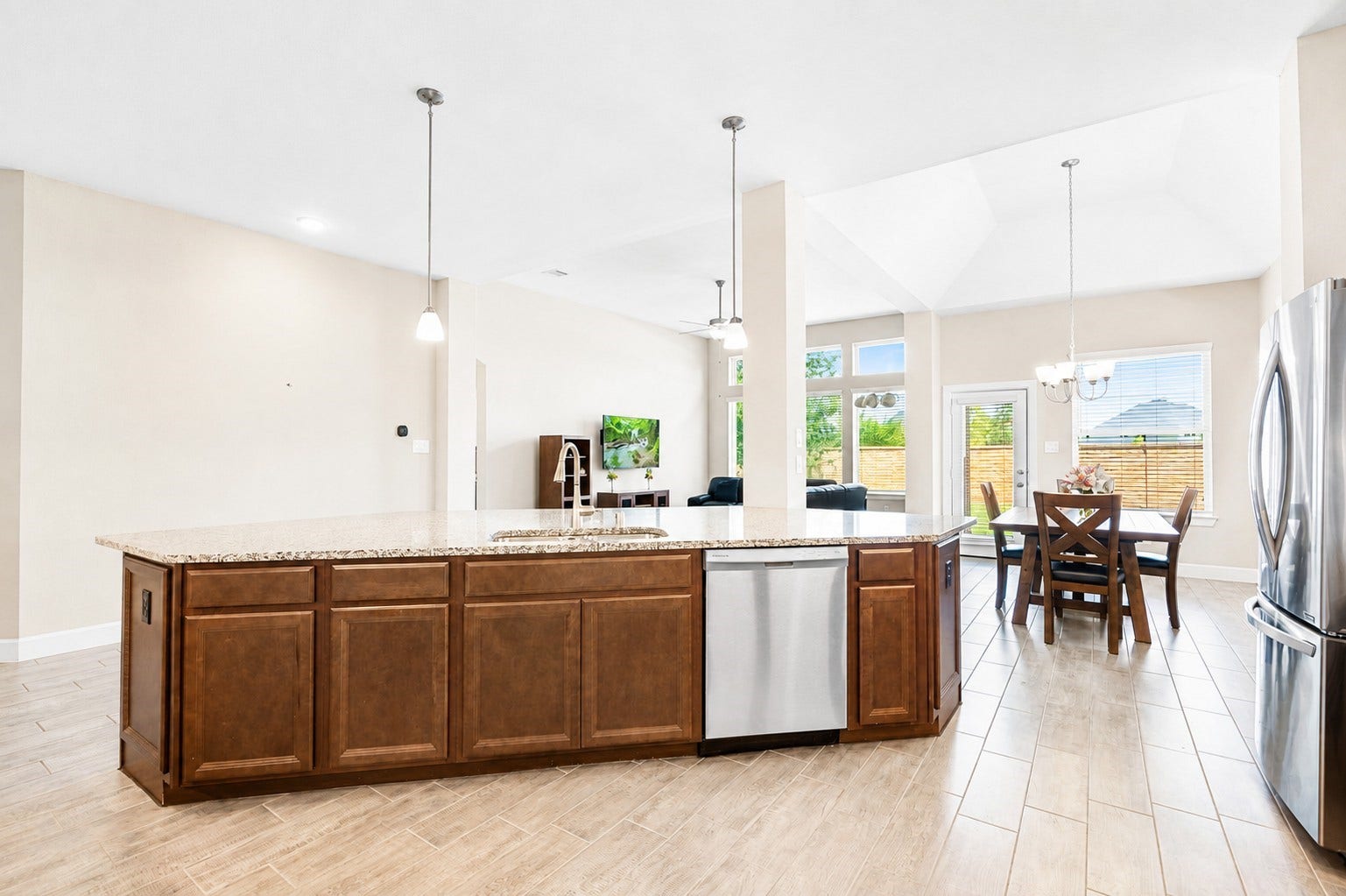 6922 Goldstrum Way, Katy, TX 77493 The oversized island offers additional prep space and opens directly into the living and dining areas, creating an ideal layout for entertaining.