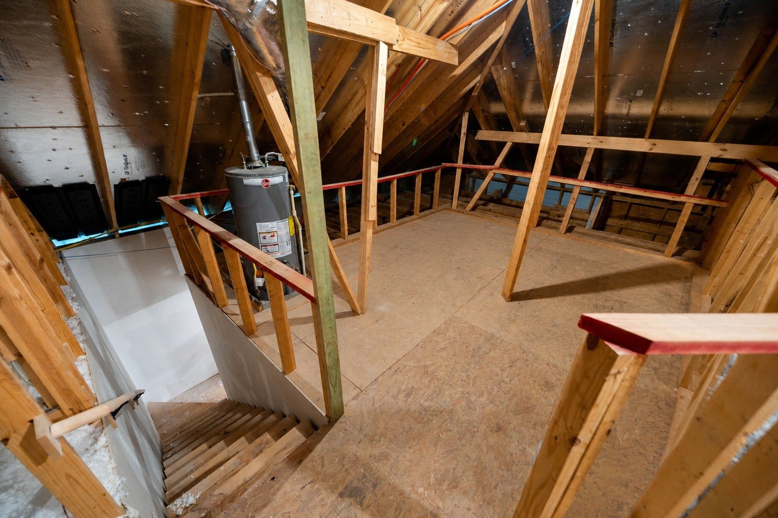 6922 Goldstrum Way, Katy, TX 77493 The home's attic storage, accessible via a staircase off the garage rather than a traditional pull-down ladder, offers generous space for bins, seasonal items, and more, with easy access to the HVAC system for filter changes. Virtually staged.