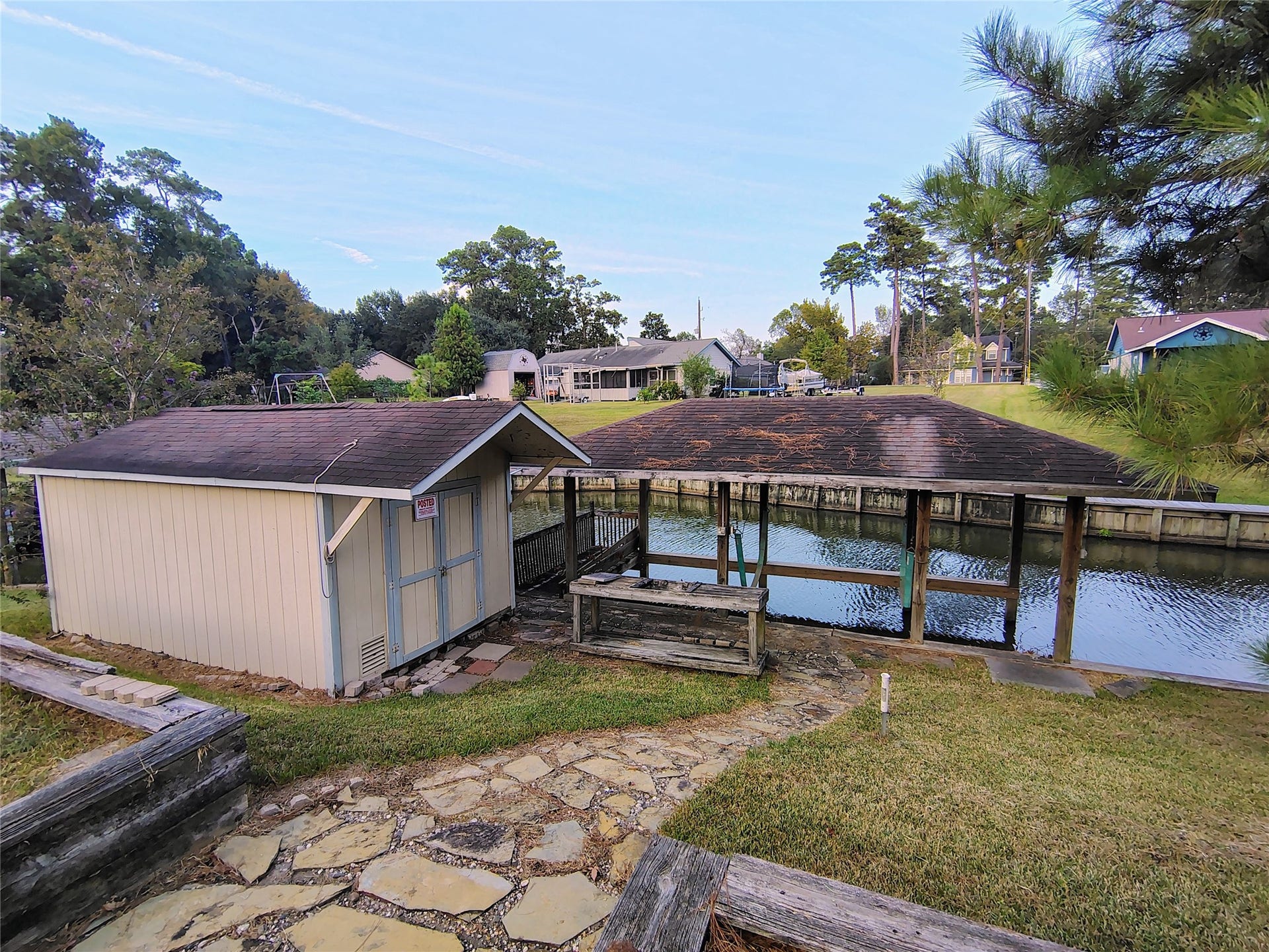 3443 Shore Shadows Drive, Crosby, TX 77532 Boat house storage equipped with electric.