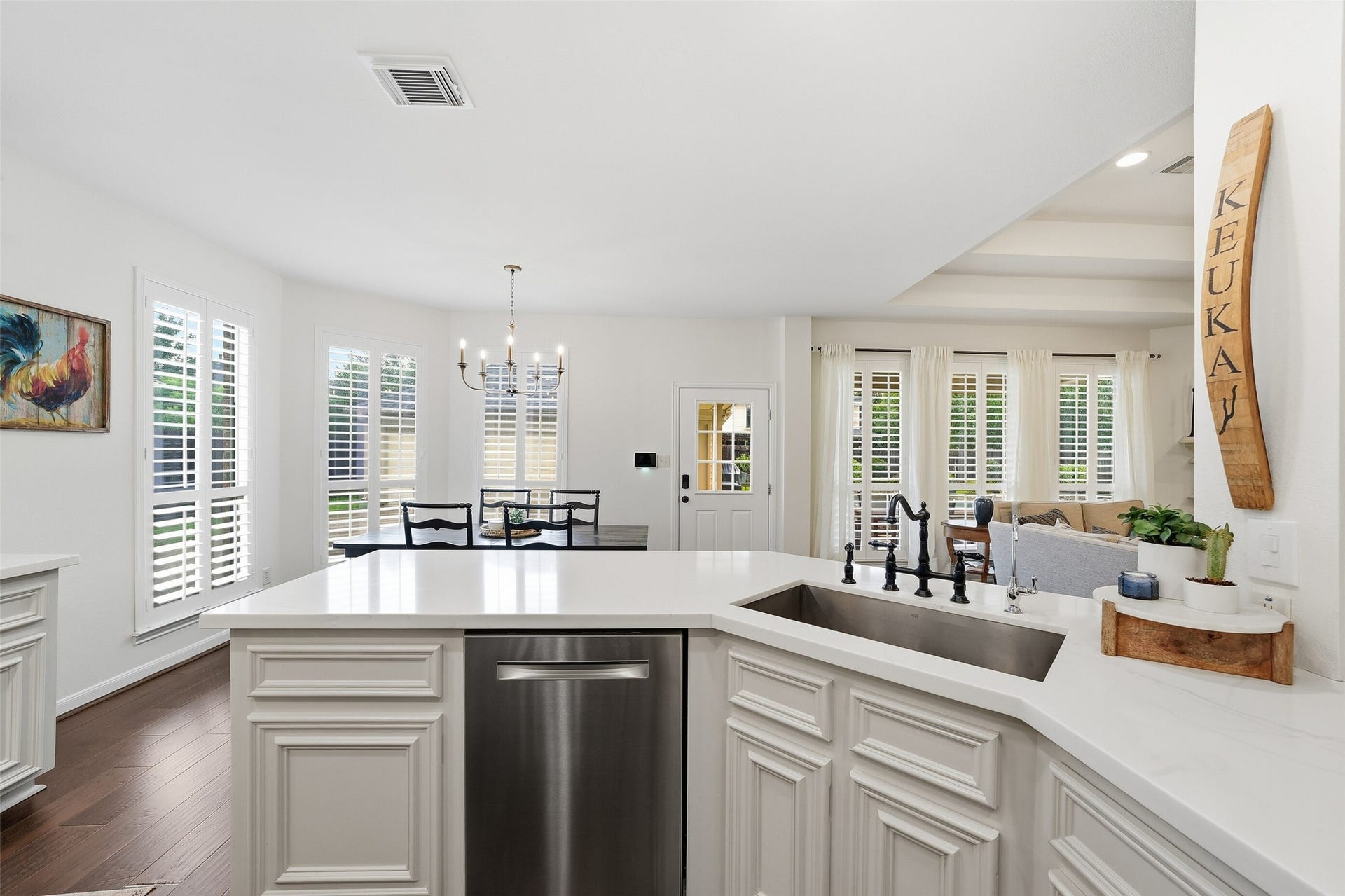 2815 Golden Larch Drive, Katy, TX 77494 The beautifully renovated kitchen includes quartz countertops, stainless steel appliances and a large farmhouse style sink.