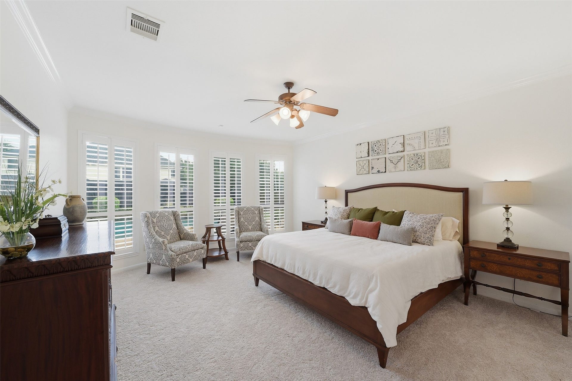 2815 Golden Larch Drive, Katy, TX 77494 The primary bedroom sits in the rear of the home with a view of the sparkling pool.