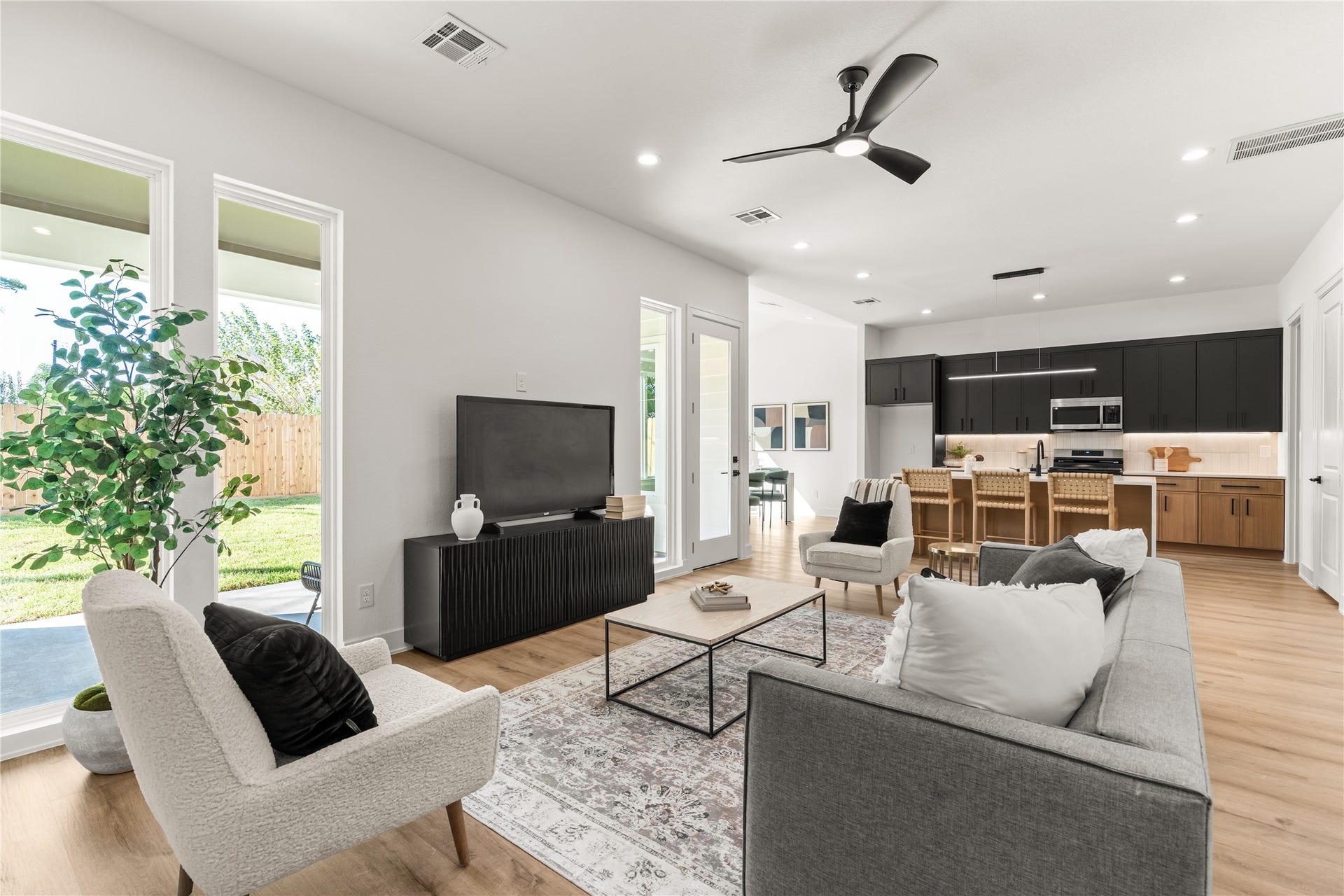 6714 Tierwester Street, Houston, TX 77021 The living room transitions naturally into the kitchen, where a generous island establishes a subtle distinction between spaces without interrupting their openness.