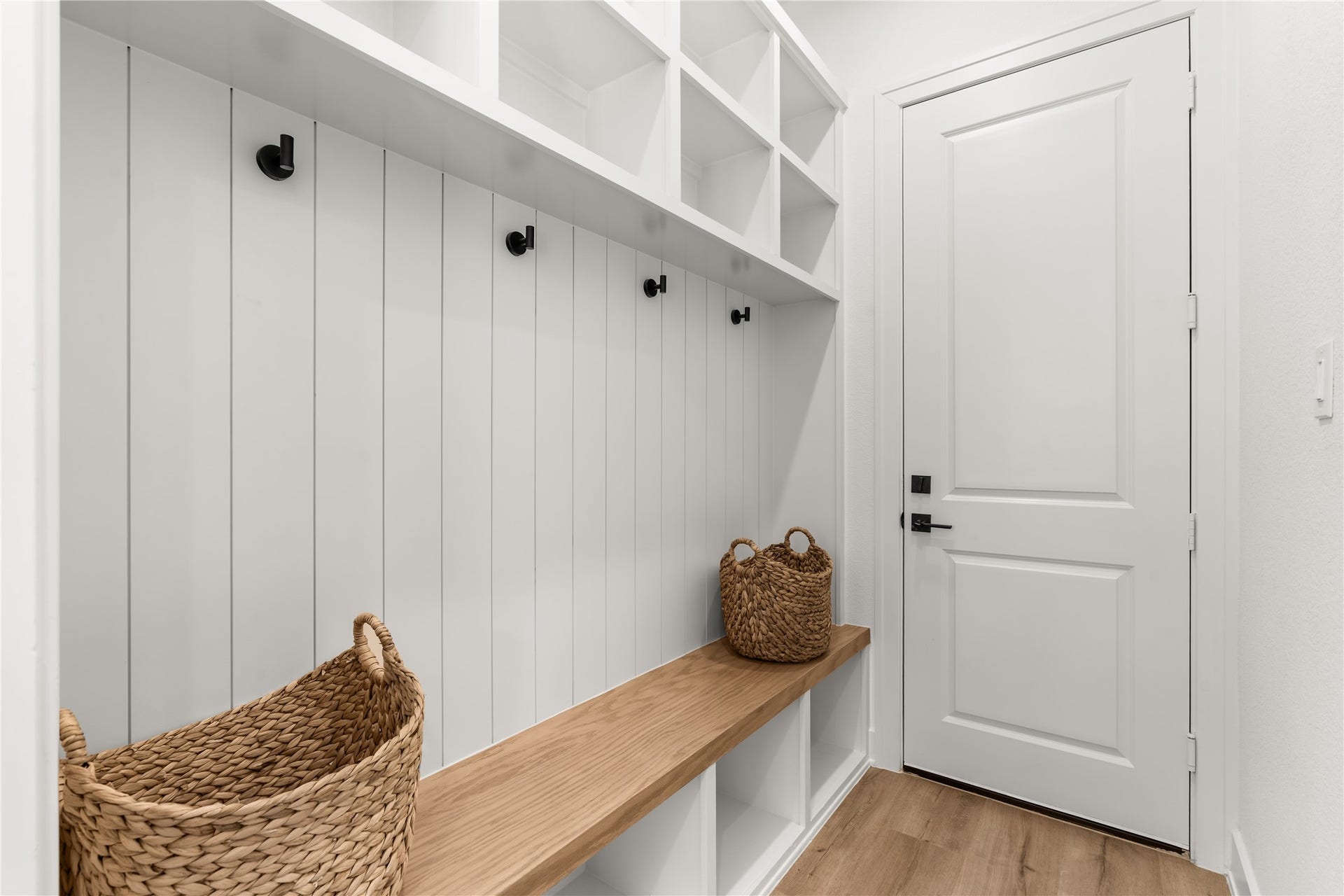 6714 Tierwester Street, Houston, TX 77021 An often-overlooked space becomes an exercise in thoughtful design, where integrated storage and a streamlined bench create a convenient landing place upon arriving home.