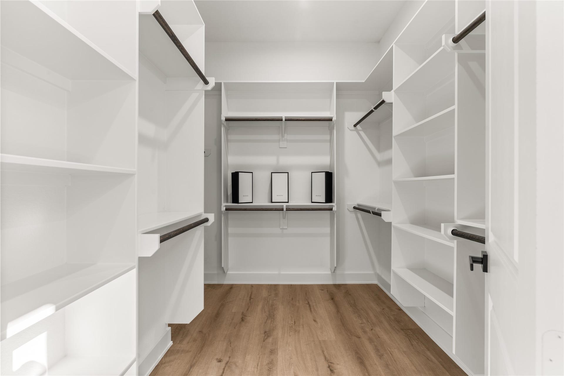 6714 Tierwester Street, Houston, TX 77021 A well-appointed walk-in closet completes the primary suite, offering generous storage through a combination of built-ins, open display shelving, and dual-level hanging space.