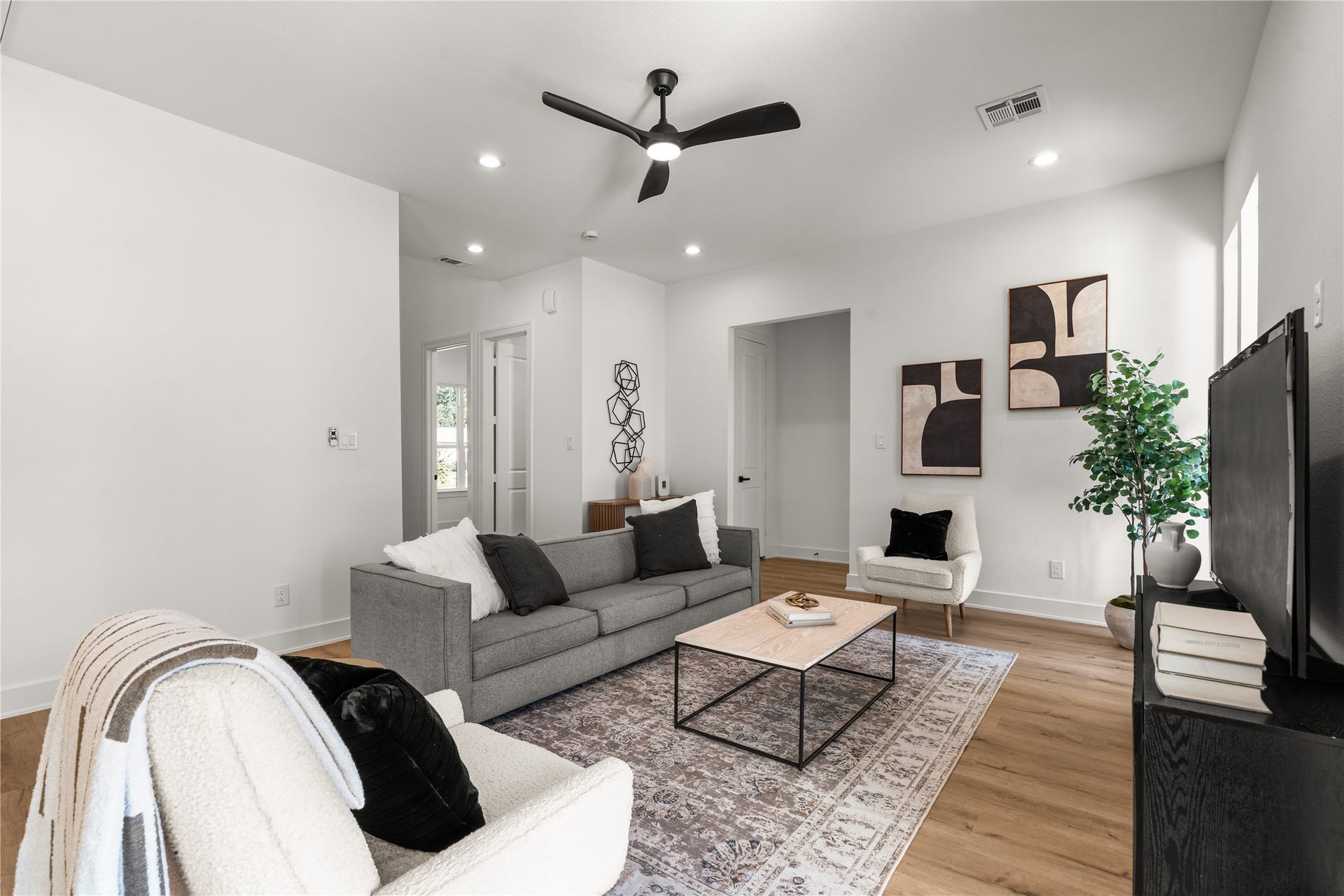 6714 Tierwester Street, Houston, TX 77021 Comfort and versatility define this spacious living area, where an open footprint accommodates intimate evenings as easily as larger gatherings.