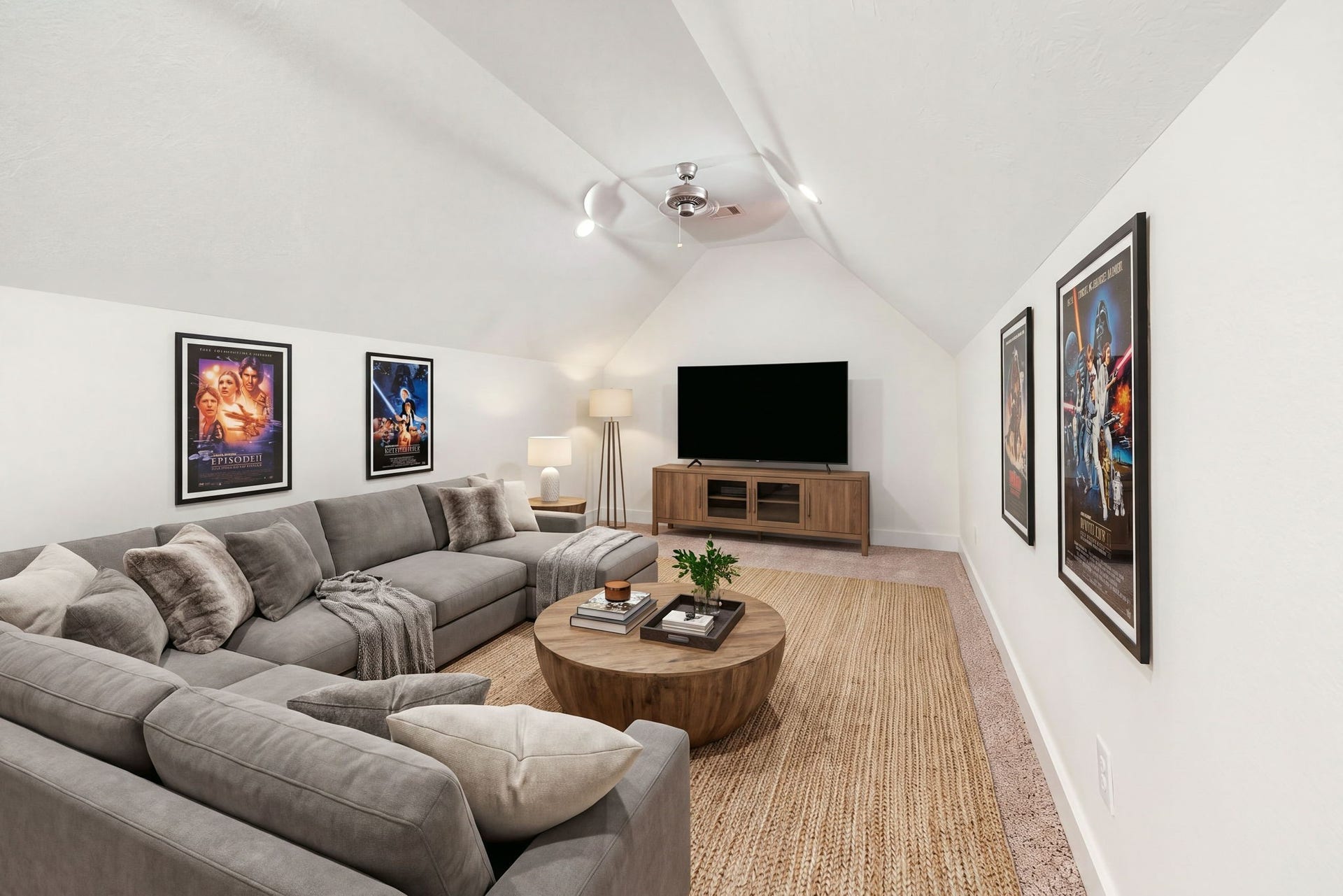 This spacious media room features a vaulted ceiling, plush carpeting, recessed lighting, and ceiling fan. The inviting entertainment space offers plenty of room for movie nights. *Virtually Staged