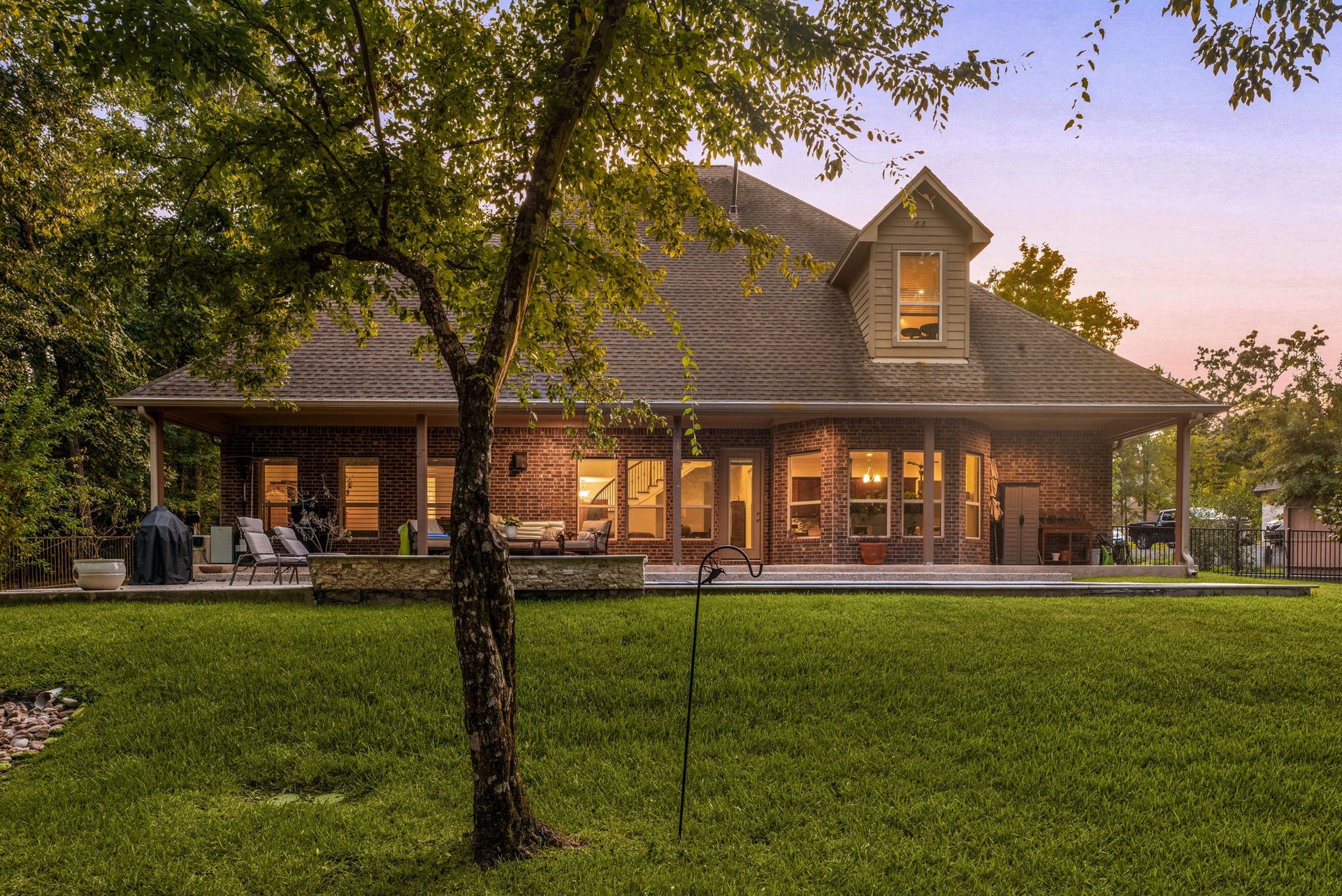 The expansive backyard offers a peaceful oasis, providing the ultimate outdoor living space for relaxation, dining, and effortless entertaining.