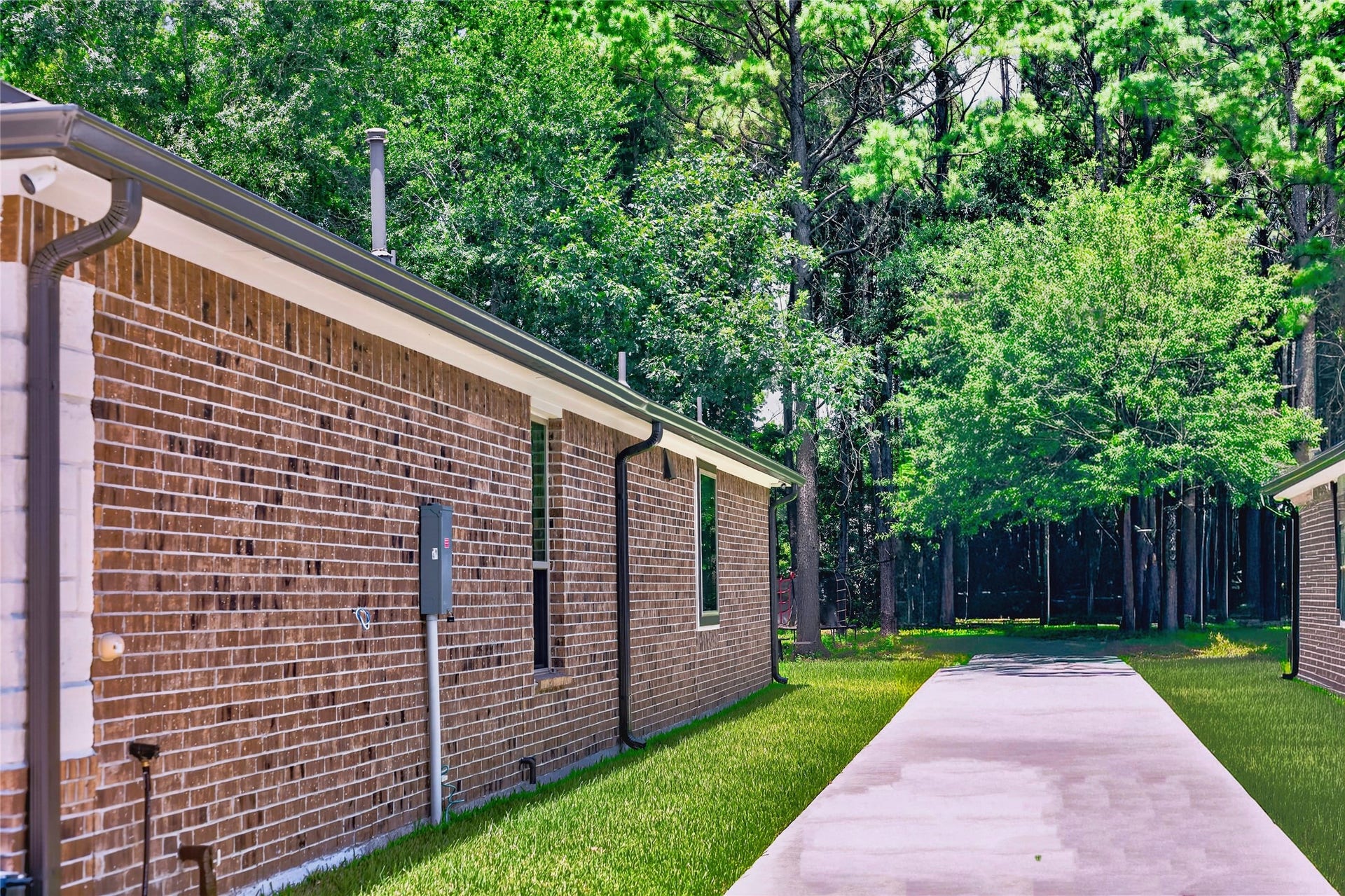 1295 Road 66112, Dayton, TX 77535 Extended driveway to store vehicles or access to backyard