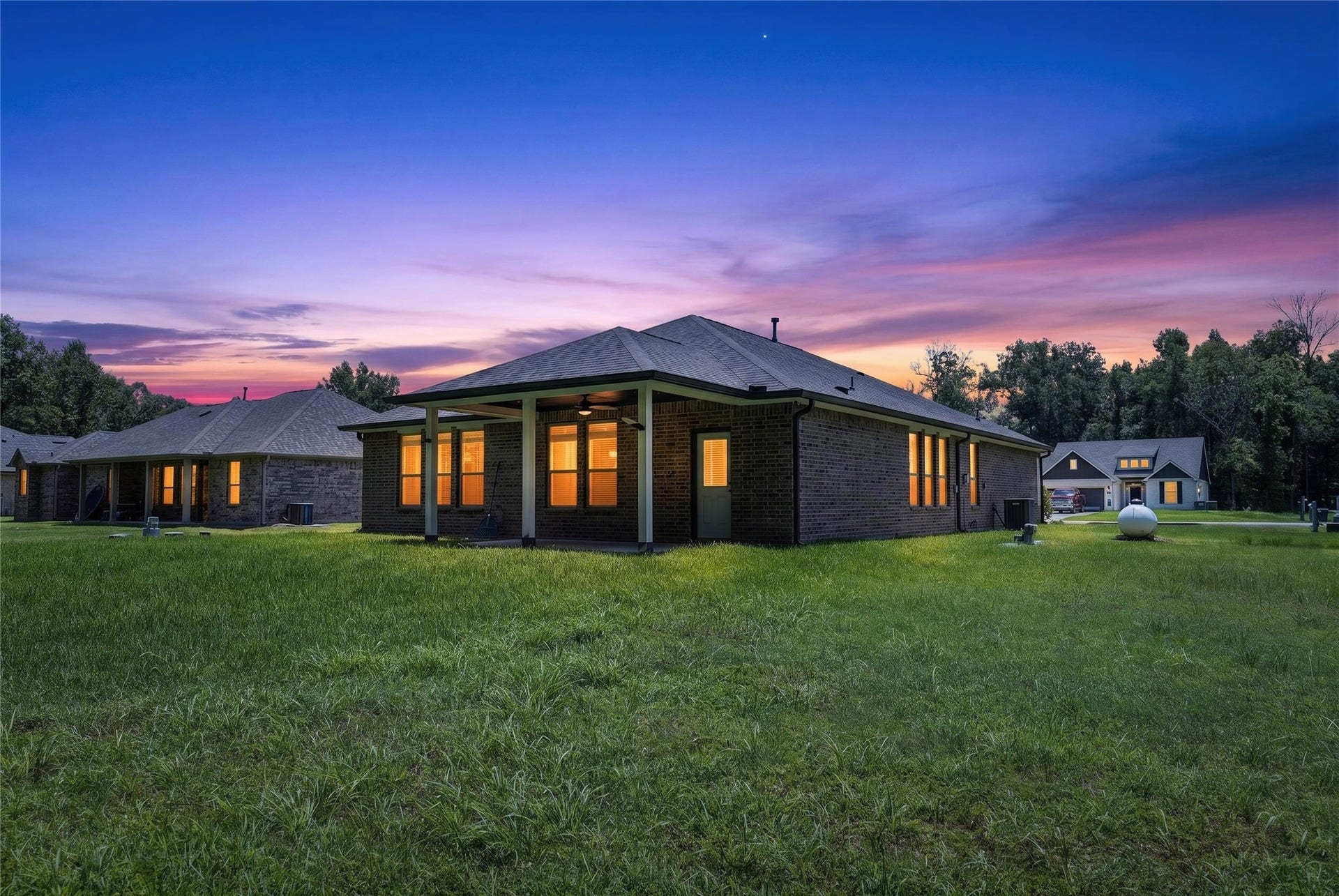 1295 Road 66112, Dayton, TX 77535 North West elevation with twilight effect