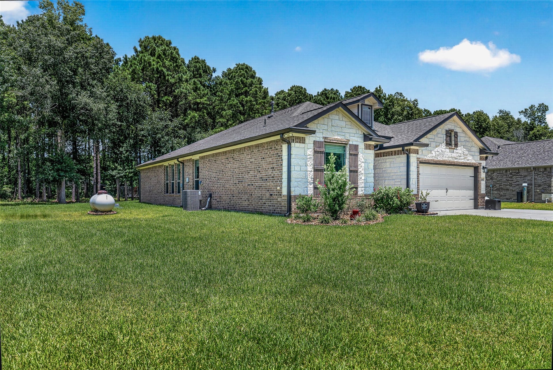 1295 Road 66112, Dayton, TX 77535 South West elevation showing large side yard