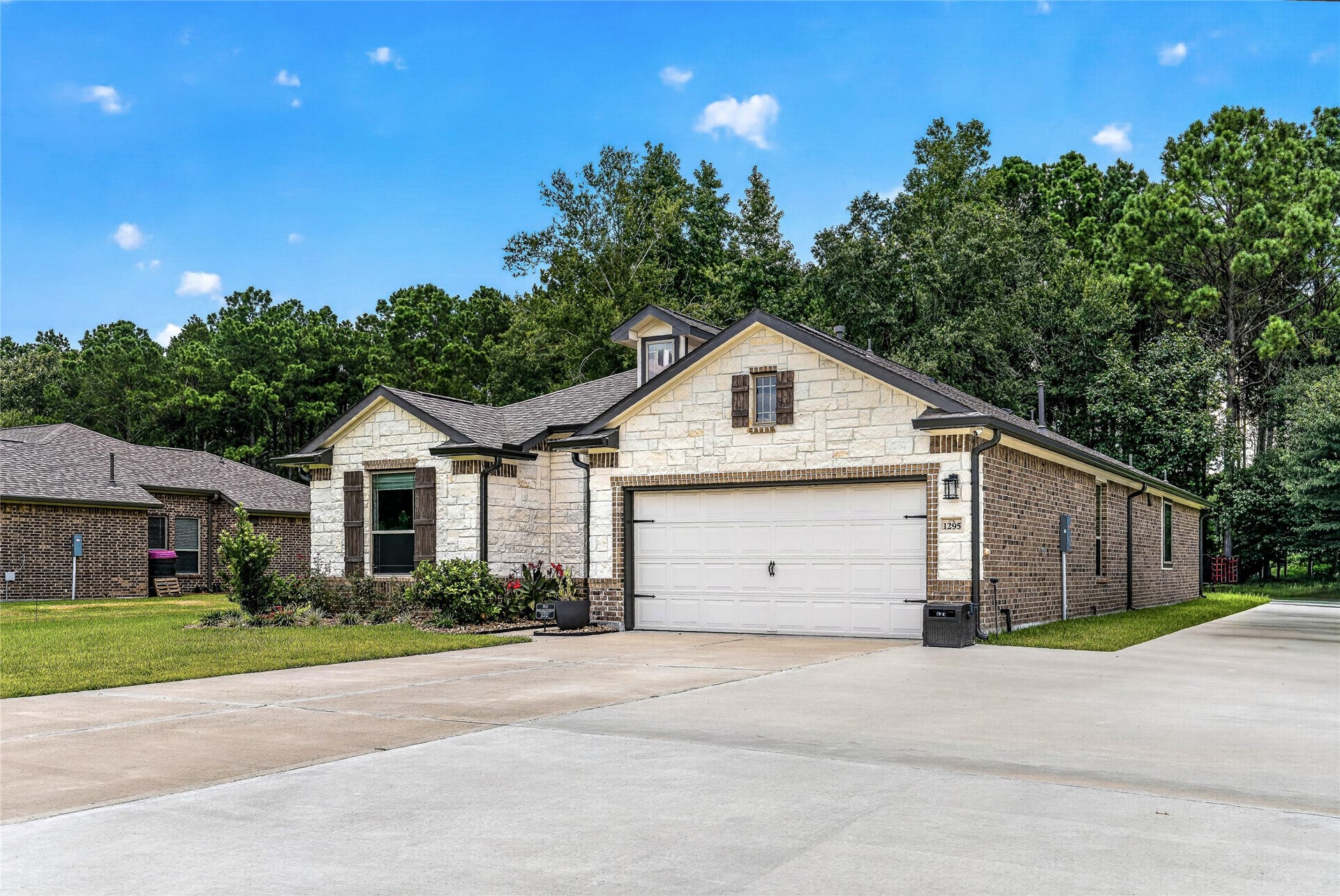 1295 Road 66112, Dayton, TX 77535 South East elevation showing extended driveway