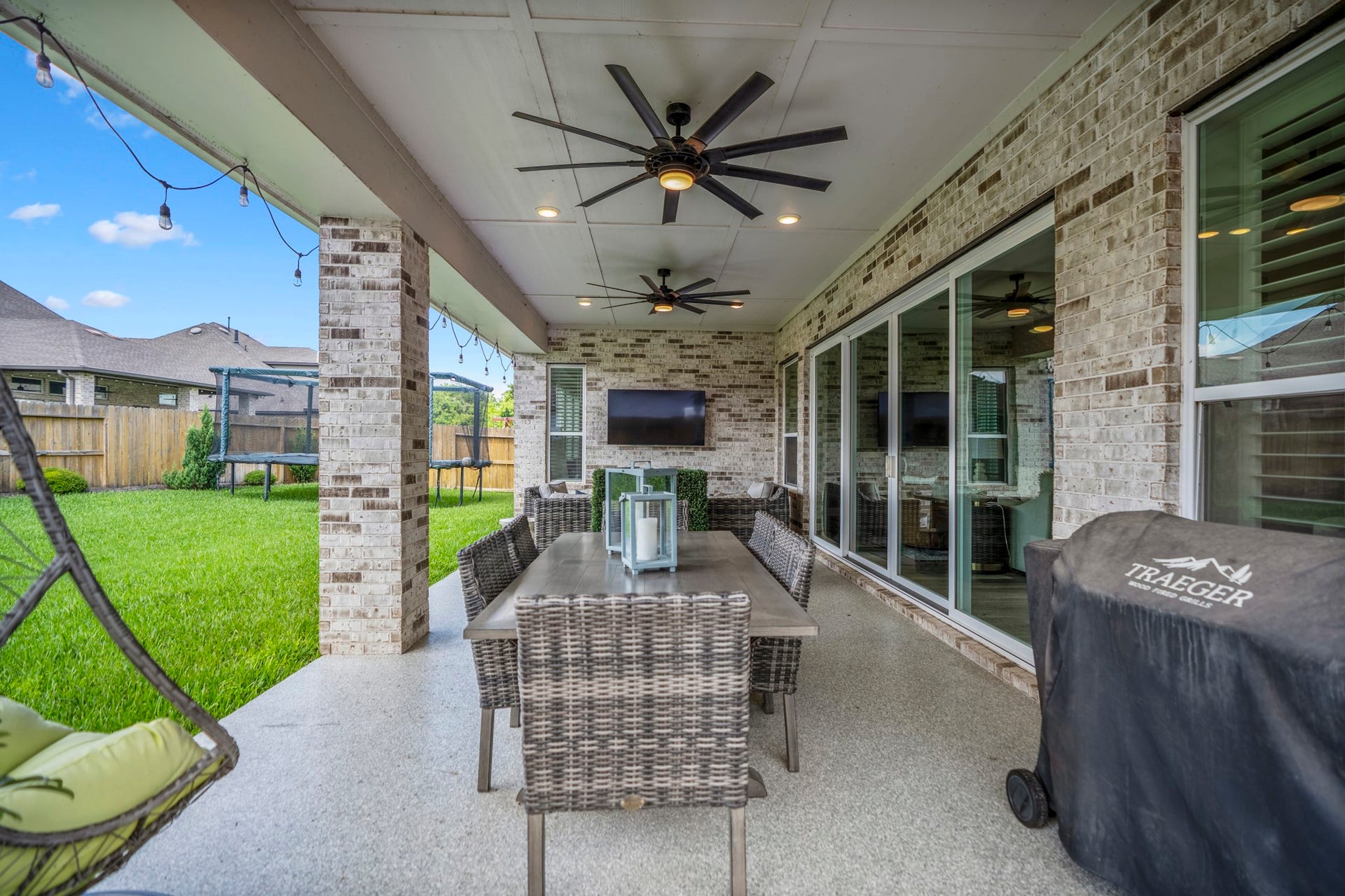 10615 Parkwood Court, Missouri City, TX 77459 Start your mornings with coffee under the covered patio and wind down in the evenings enjoying outdoor dinners with plenty of space to gather, relax, and enjoy the backyard views.
