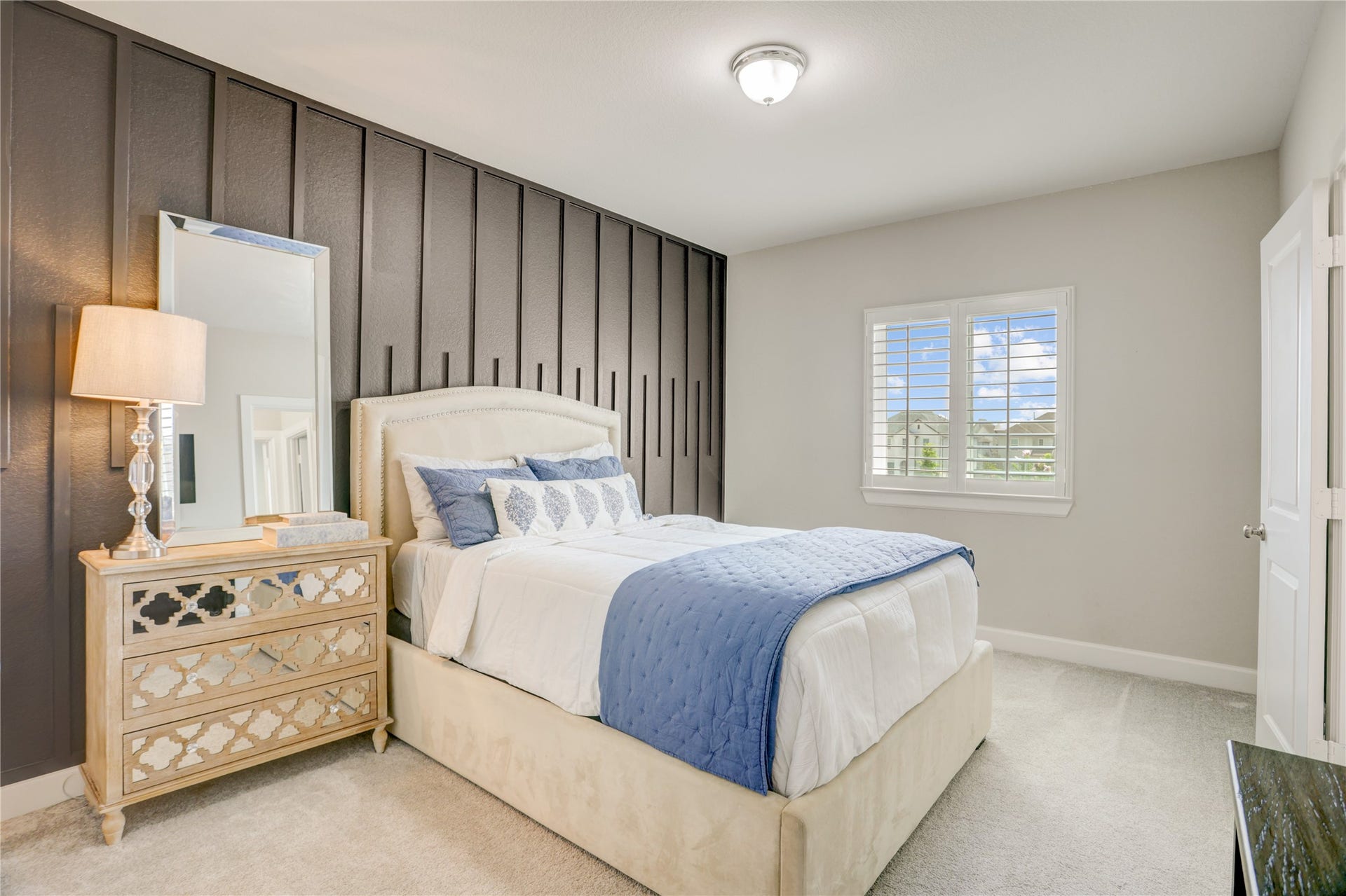 10615 Parkwood Court, Missouri City, TX 77459 Well sized secondary bedroom with direct access to a Jack and Jill bath, offering a practical layout that blends privacy and convenience for family or guests.