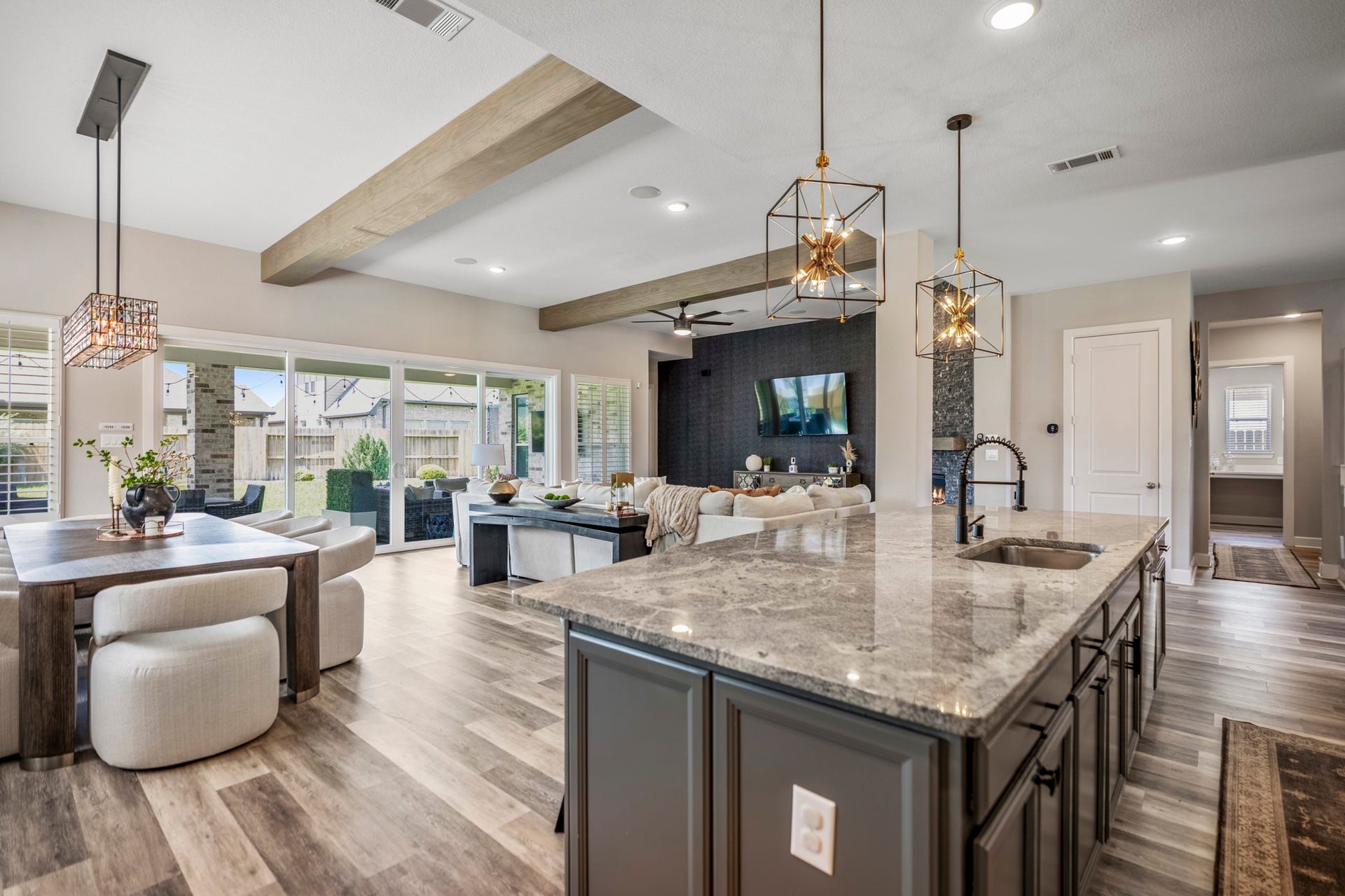10615 Parkwood Court, Missouri City, TX 77459 Thoughtfully designed main living spaces offer exceptional flow and connectivity, creating an ideal setting for gathering, entertaining, and everyday living. Expansive sight lines, oversized windows, and carefully curated finishes bring warmth, natural light, and a refined modern feel throughout the heart of the home.